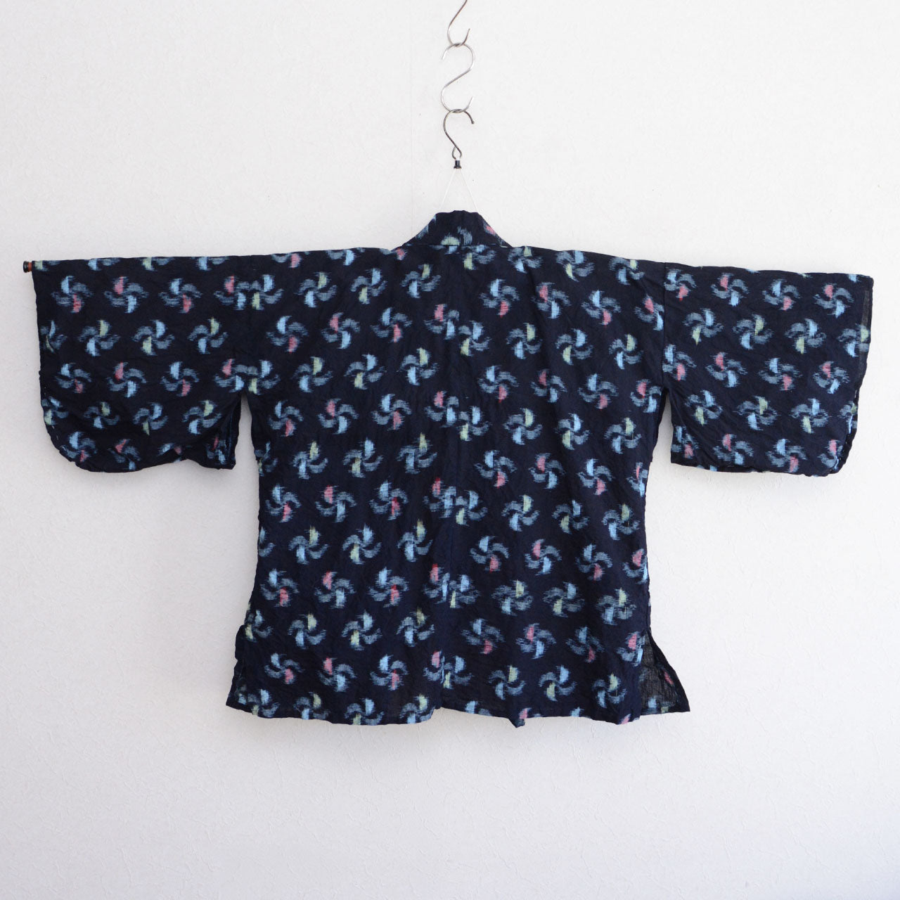 Vintage noragi, pinwheel kasuri pattern, aged indigo cotton textile