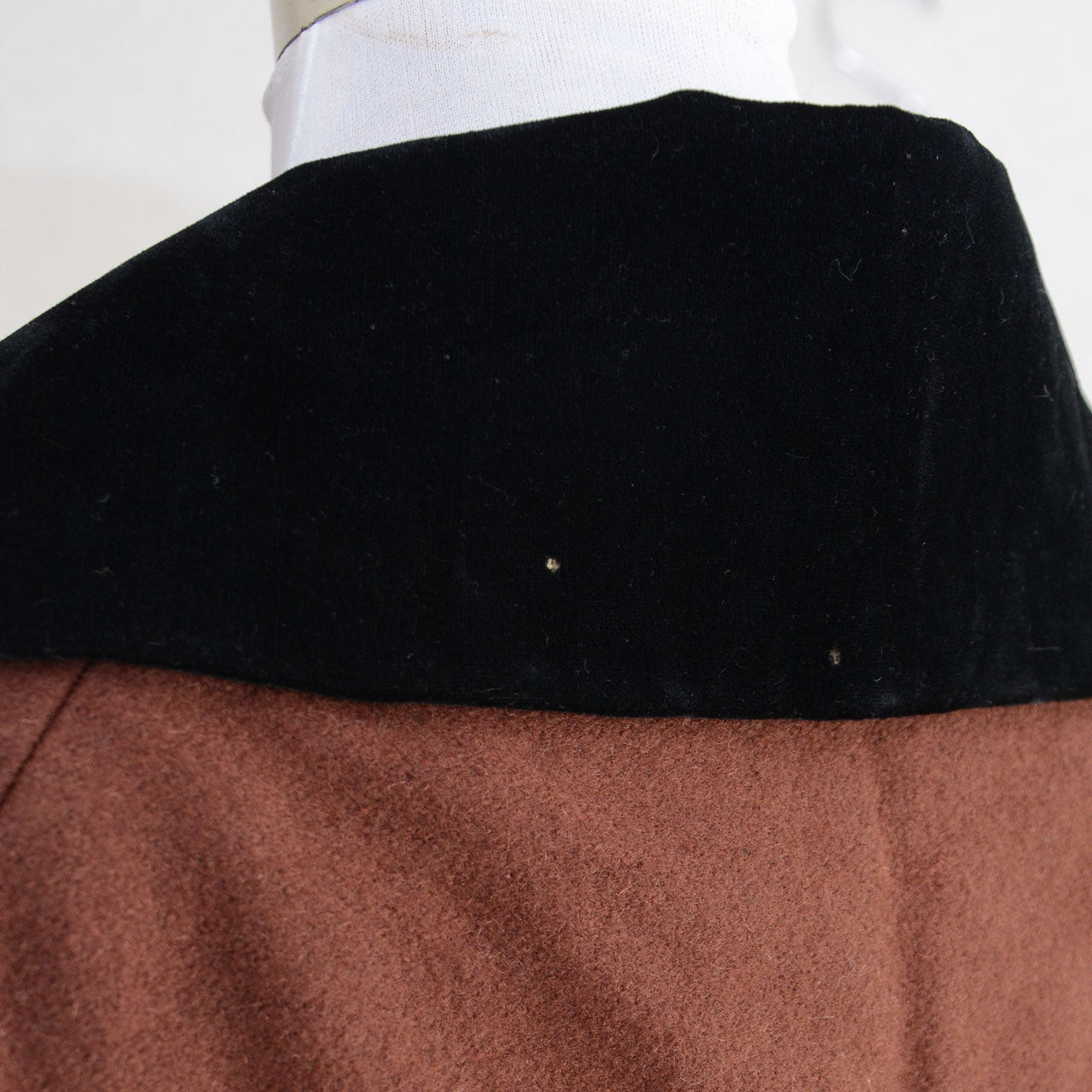 Timeless Japanese wool cape highlighting natural movement and graceful shoulder line