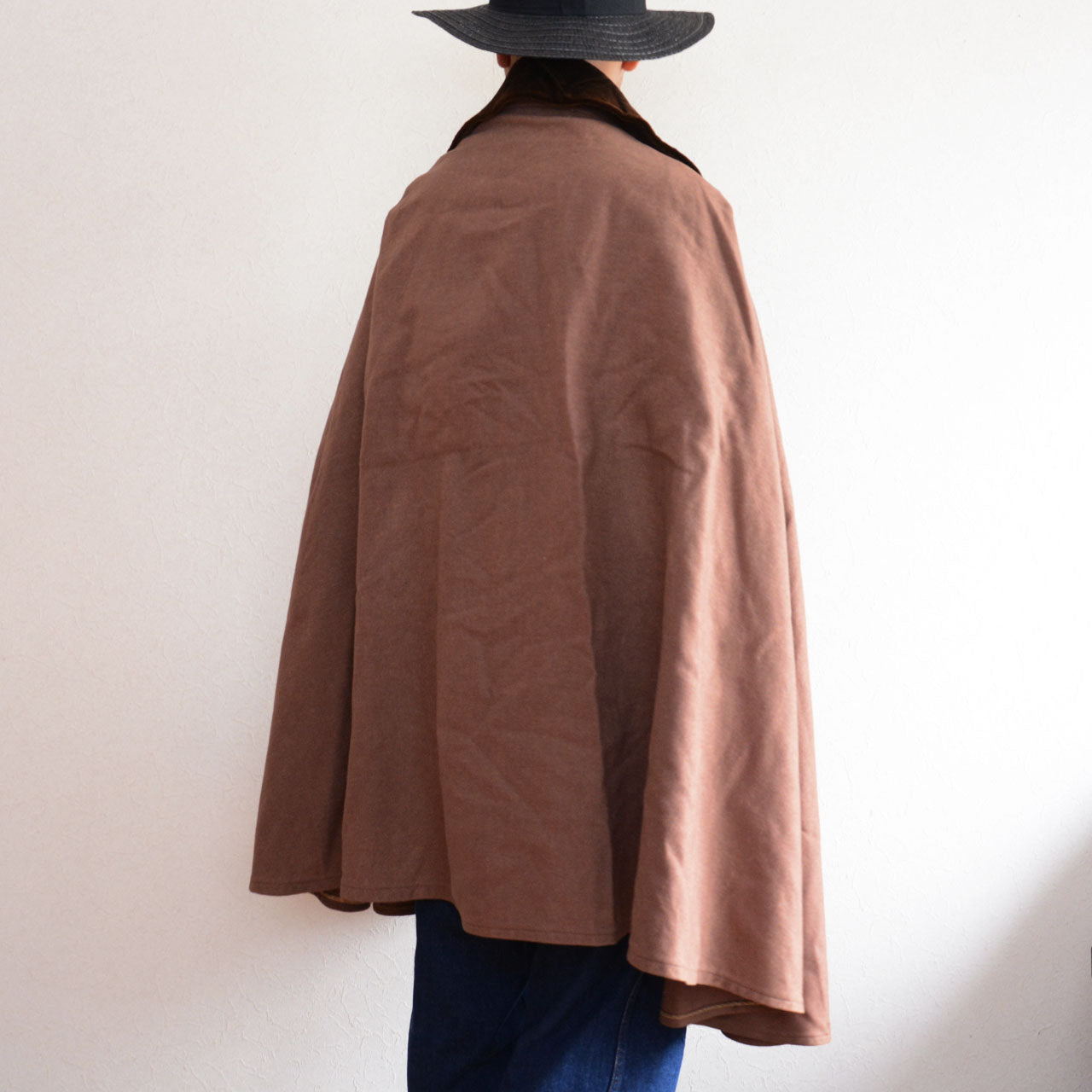 Soft textured wool cape enhancing outfit elegance and individuality