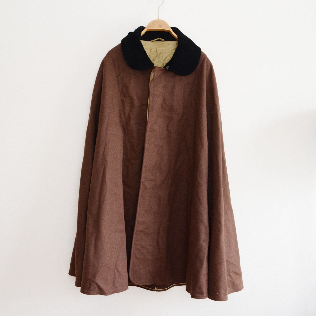 A Japan vintage wool mantle with a sculpted cape silhouette for modern layering