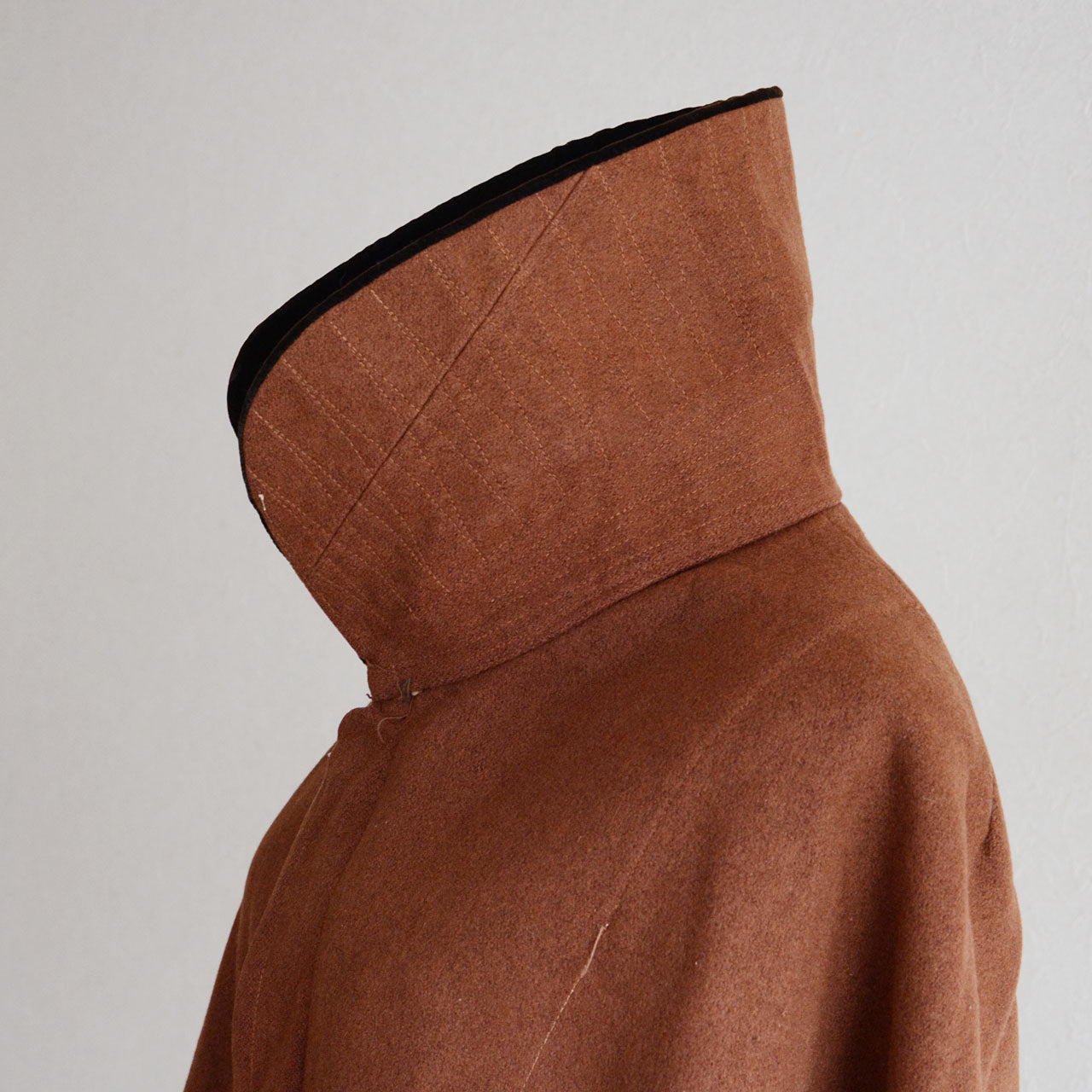 Aged Japanese wool cape with texture shaped by decades of wear and time