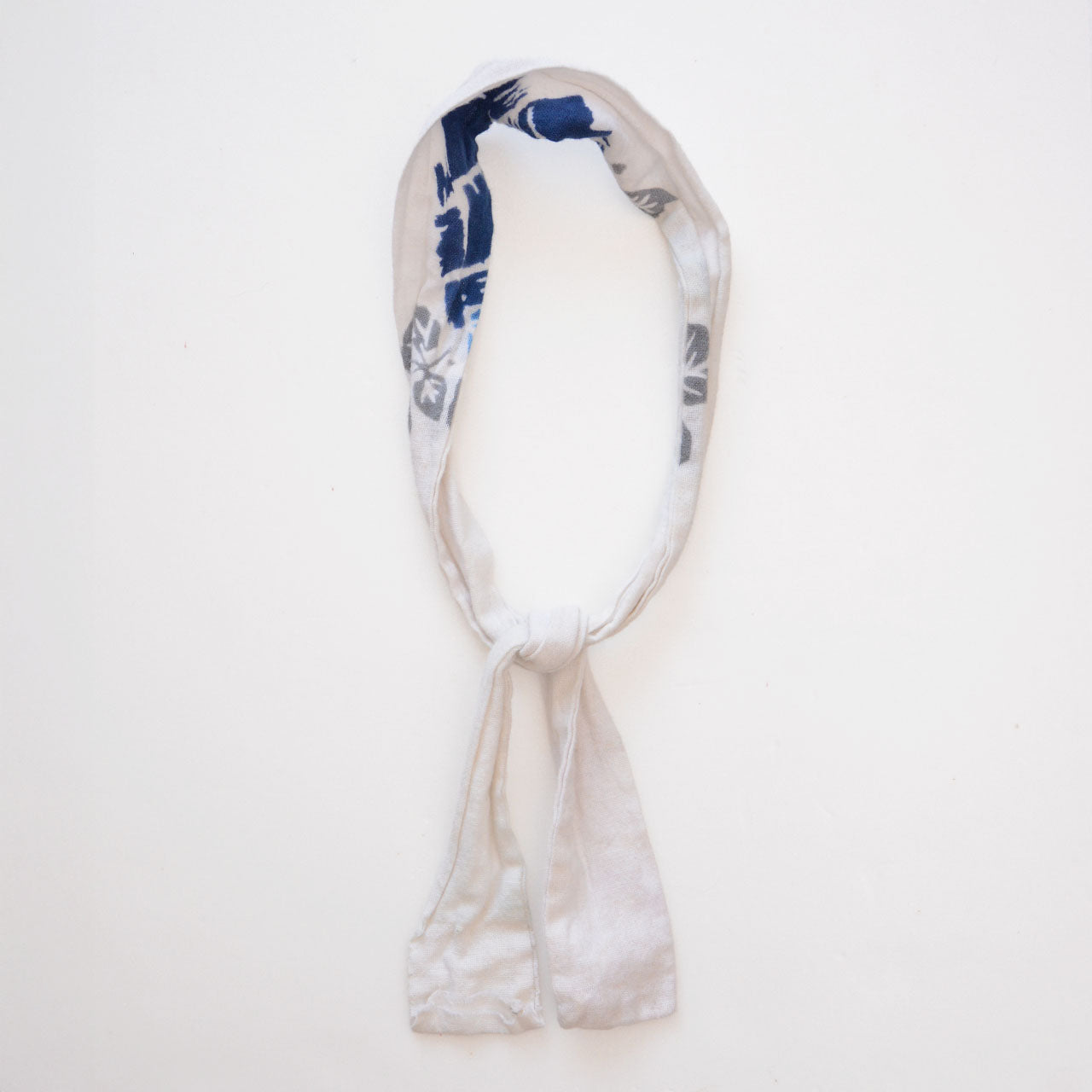 Cotton tenugui cord wrapped around a neck like a scarf