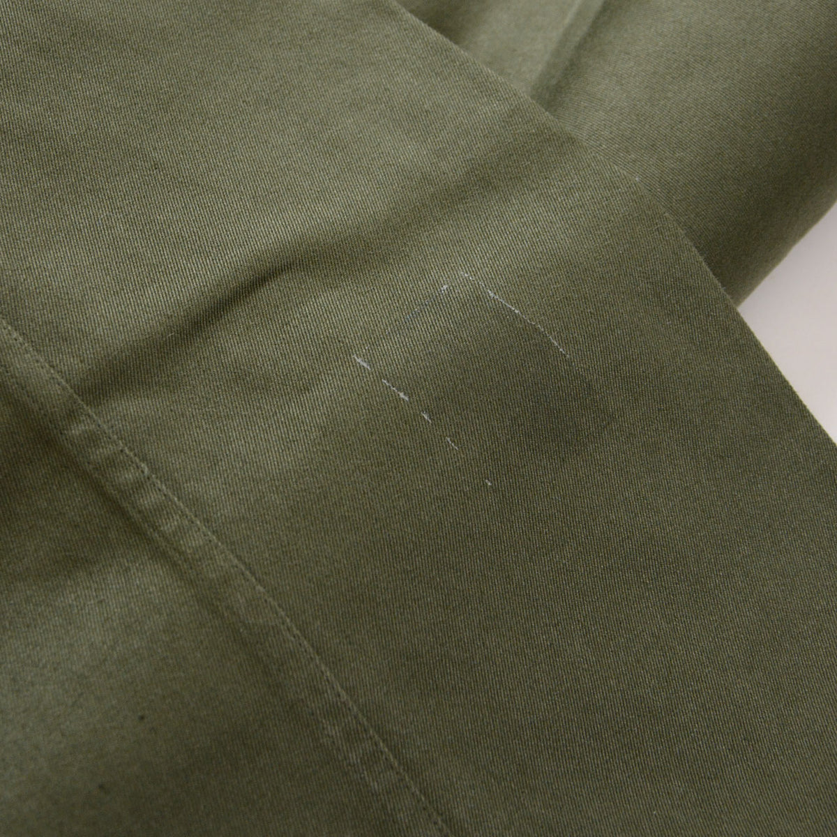 JGSDF Type 65 work trousers in OD olive drab showing marks from a removed sticker