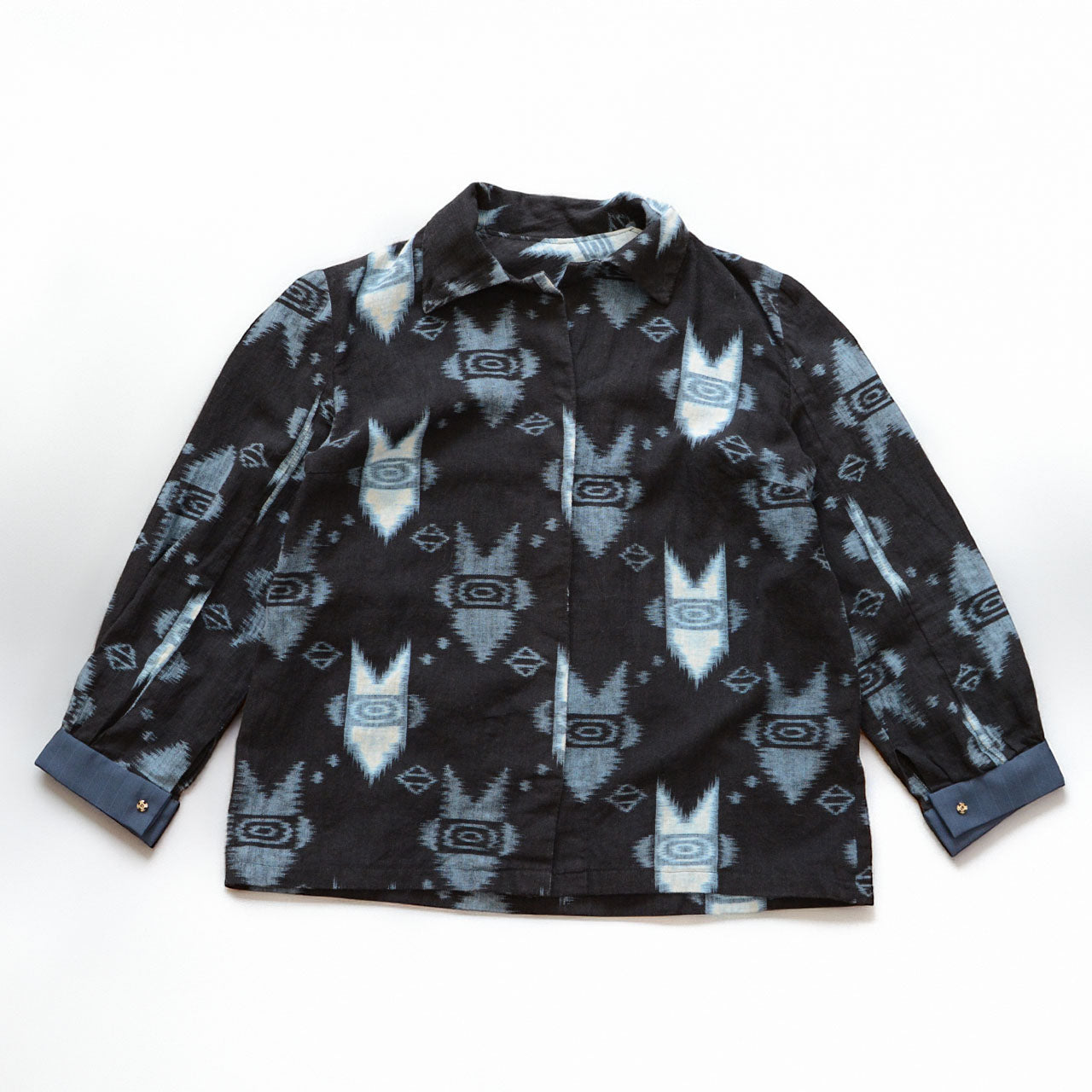 Kasuri ikat cotton shirt, flat lay front — geometric arrow and diamond pattern, handmade Japan vintage mid-Showa