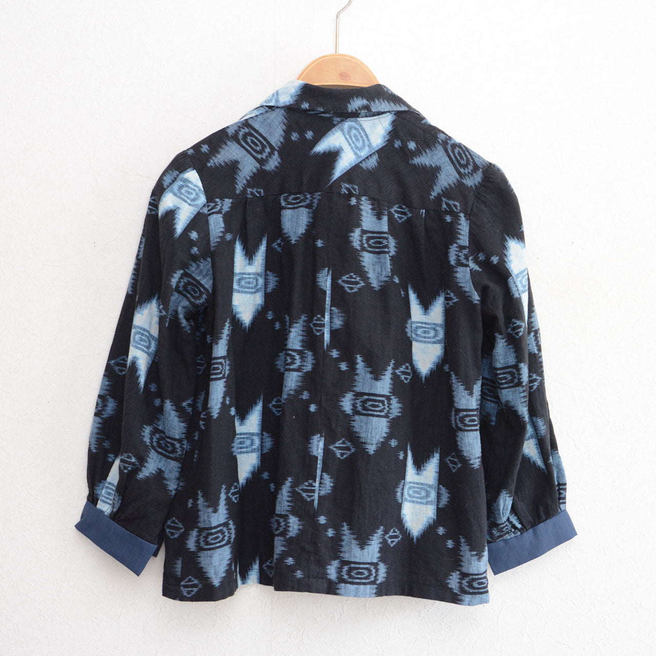 Kasuri ikat cotton shirt on hanger, back view — handmade Japan vintage mid-Showa, kasuri ikat cotton