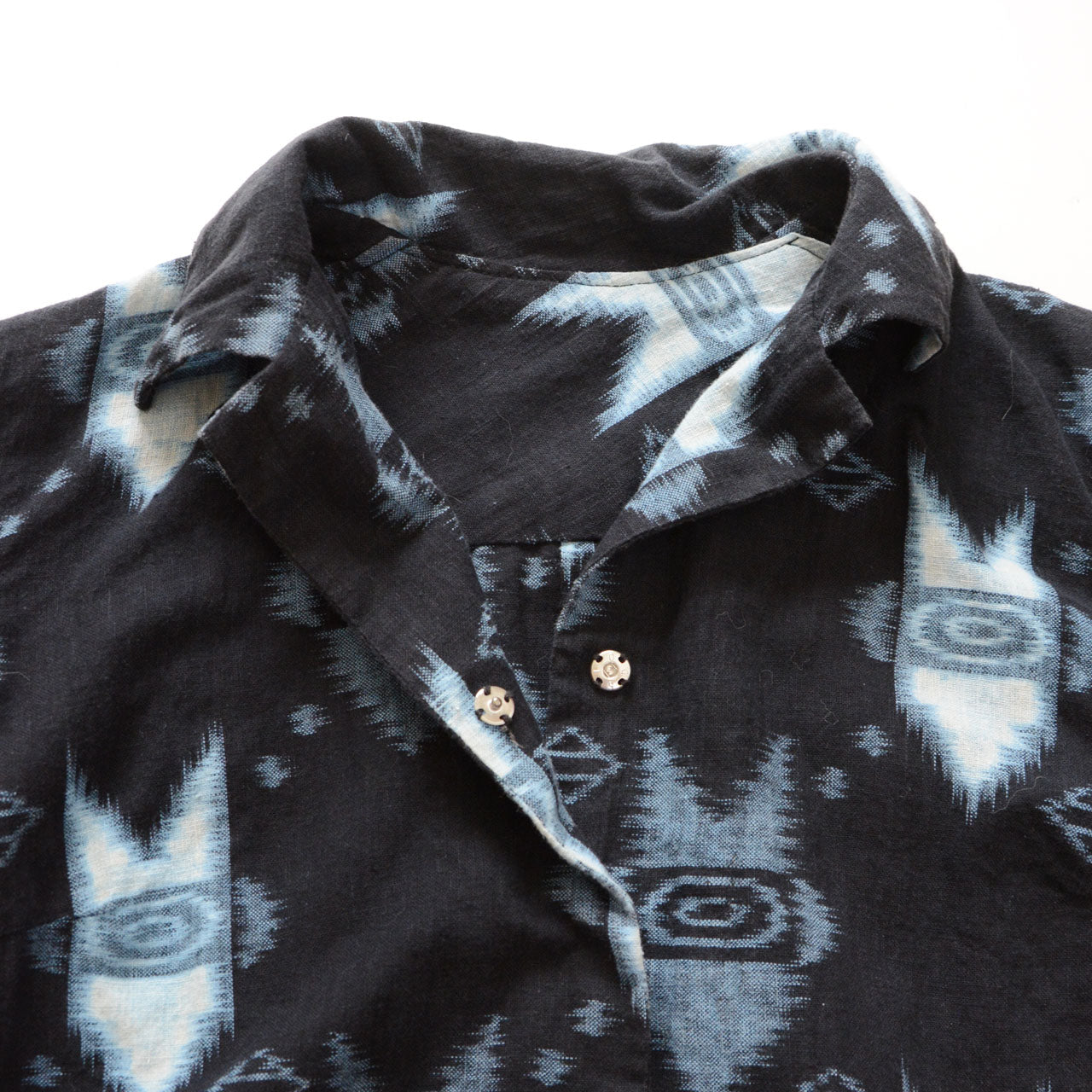 Collar and snap button detail of kasuri ikat cotton shirt — handmade Japan vintage mid-Showa