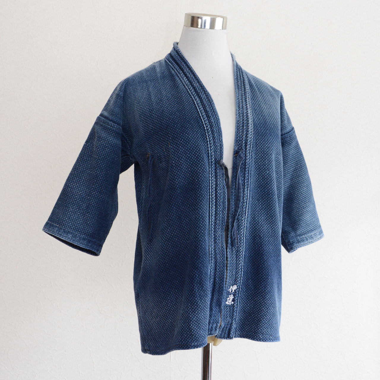 Japanese indigo-dyed kendo jacket made from textured cotton.