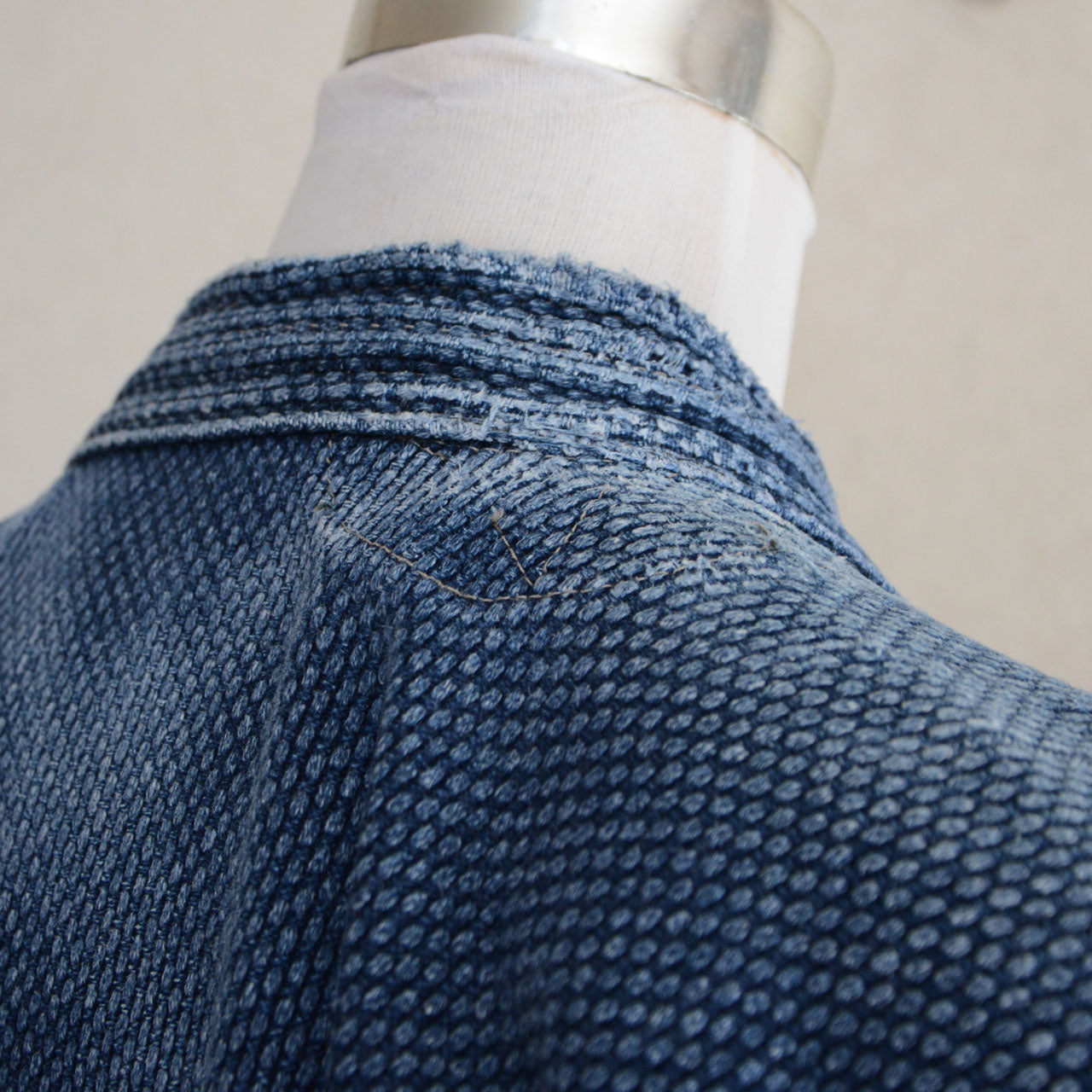 Indigo Japanese kendo jacket with visible cotton texture.