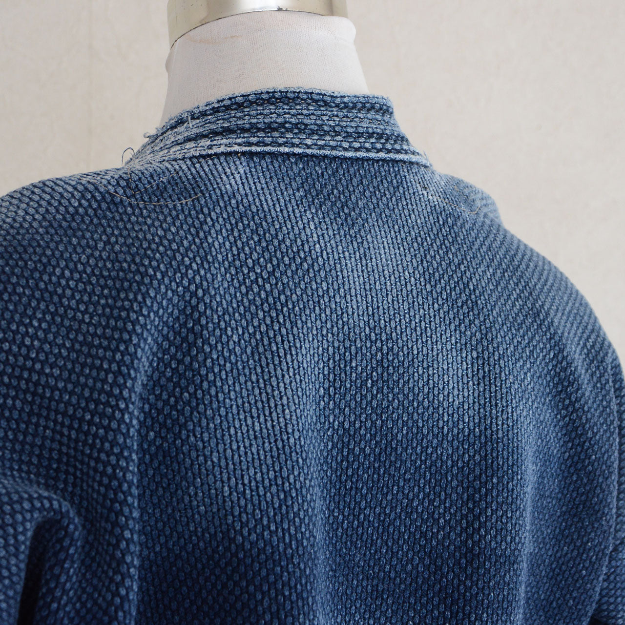 Vintage indigo kendo jacket representing Japanese textile craftsmanship.