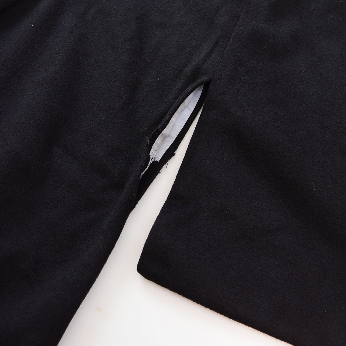 Damage at the Miyatsuguchi underarm opening of a black wool Japanese vintage kimono coat