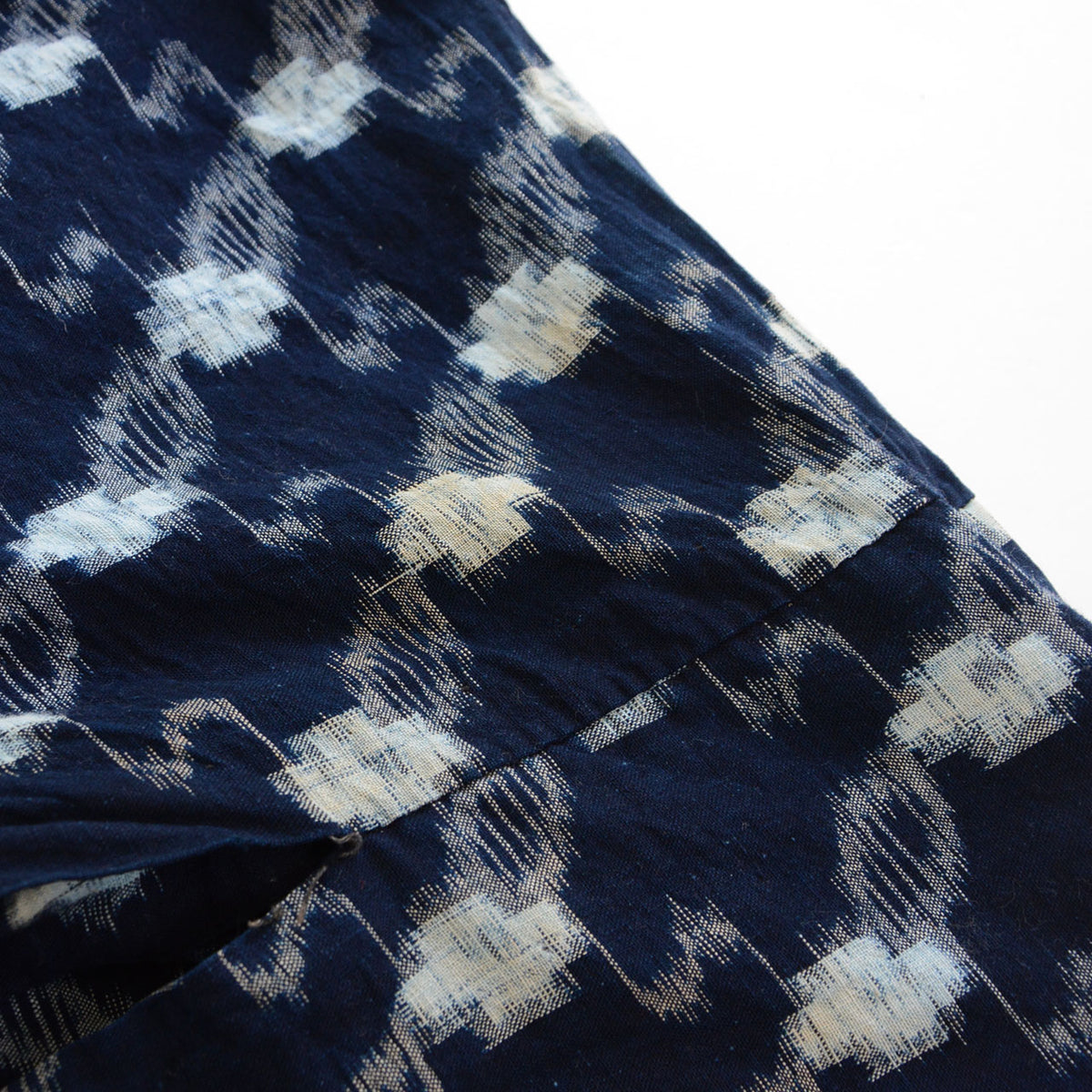 Close-up of yellowed stains on the white kasuri motifs of an indigo cotton kimono robe