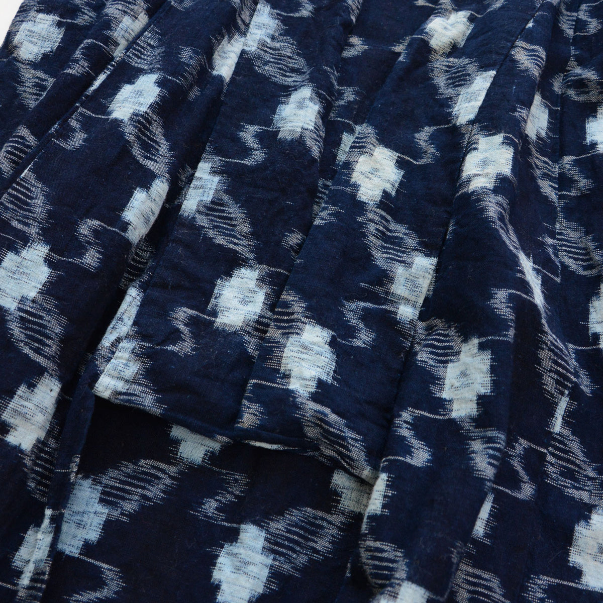 Close-up of the lower collar of an indigo kasuri cotton kimono robe