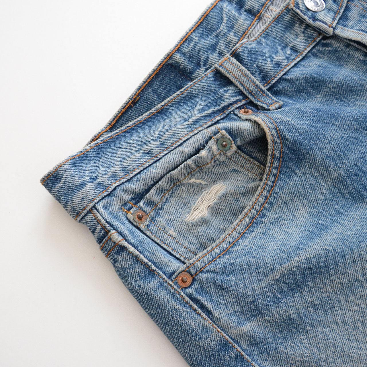 Levi's 501 button fly jeans, vintage straight leg silhouette, indigo wash