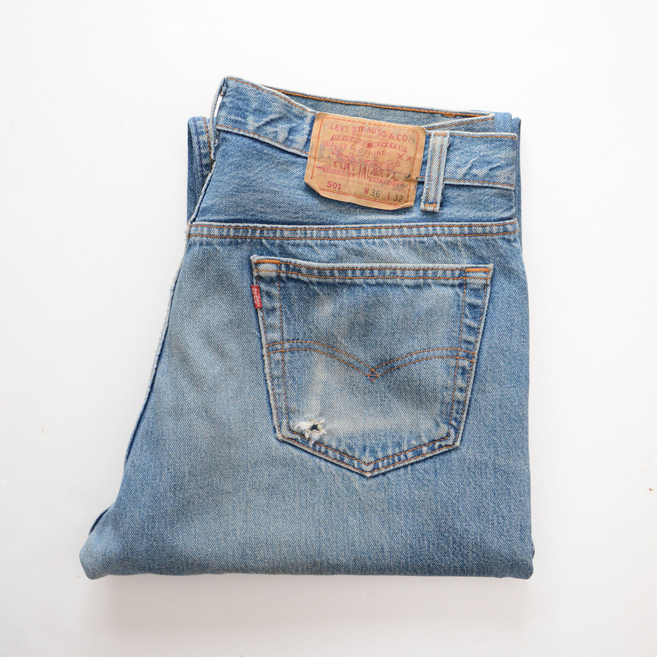 Levi's 501 denim jeans, indigo wash, raw cut hem, cotton fabric
