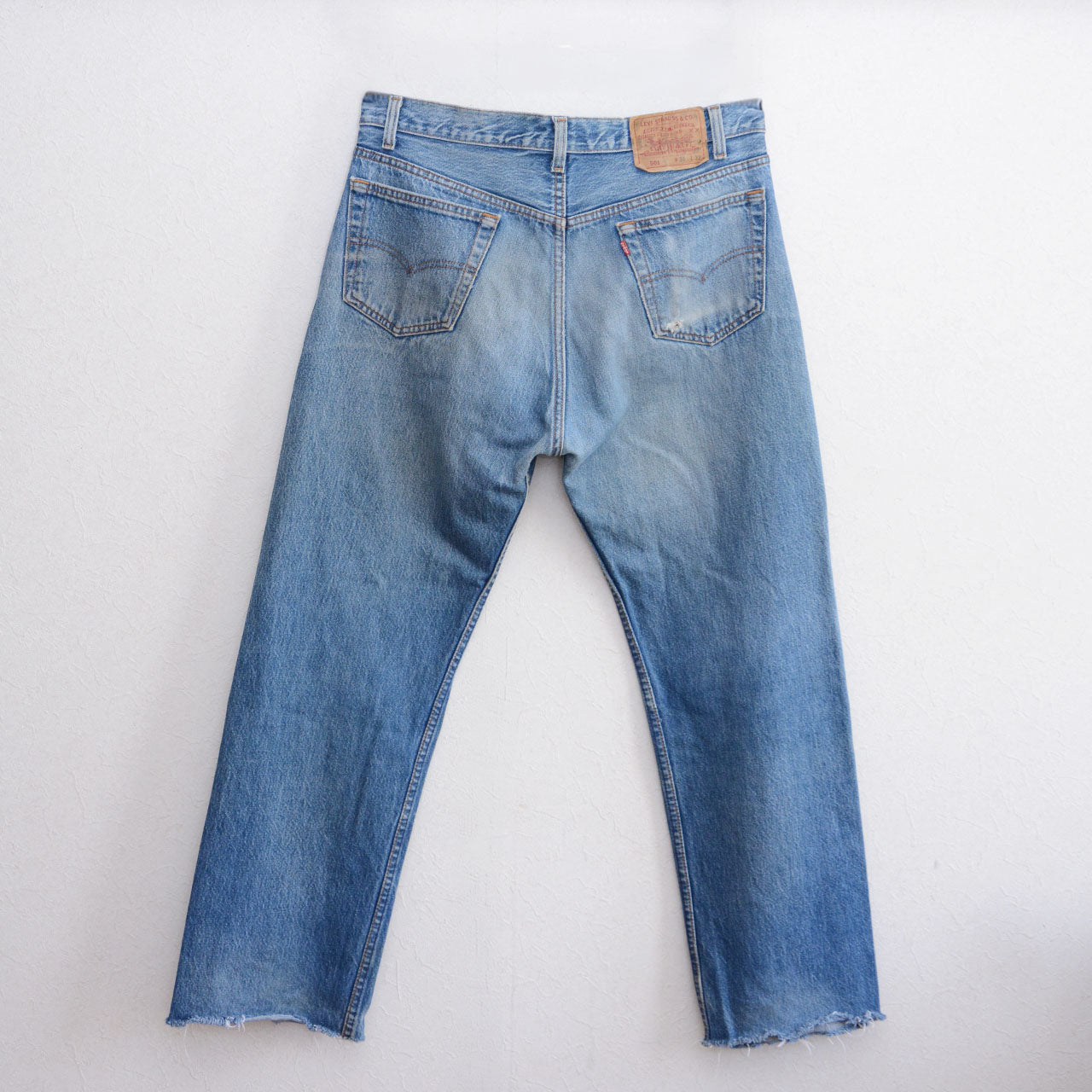 Levi's 501 denim jeans, raw cut hem, distressed vintage wear