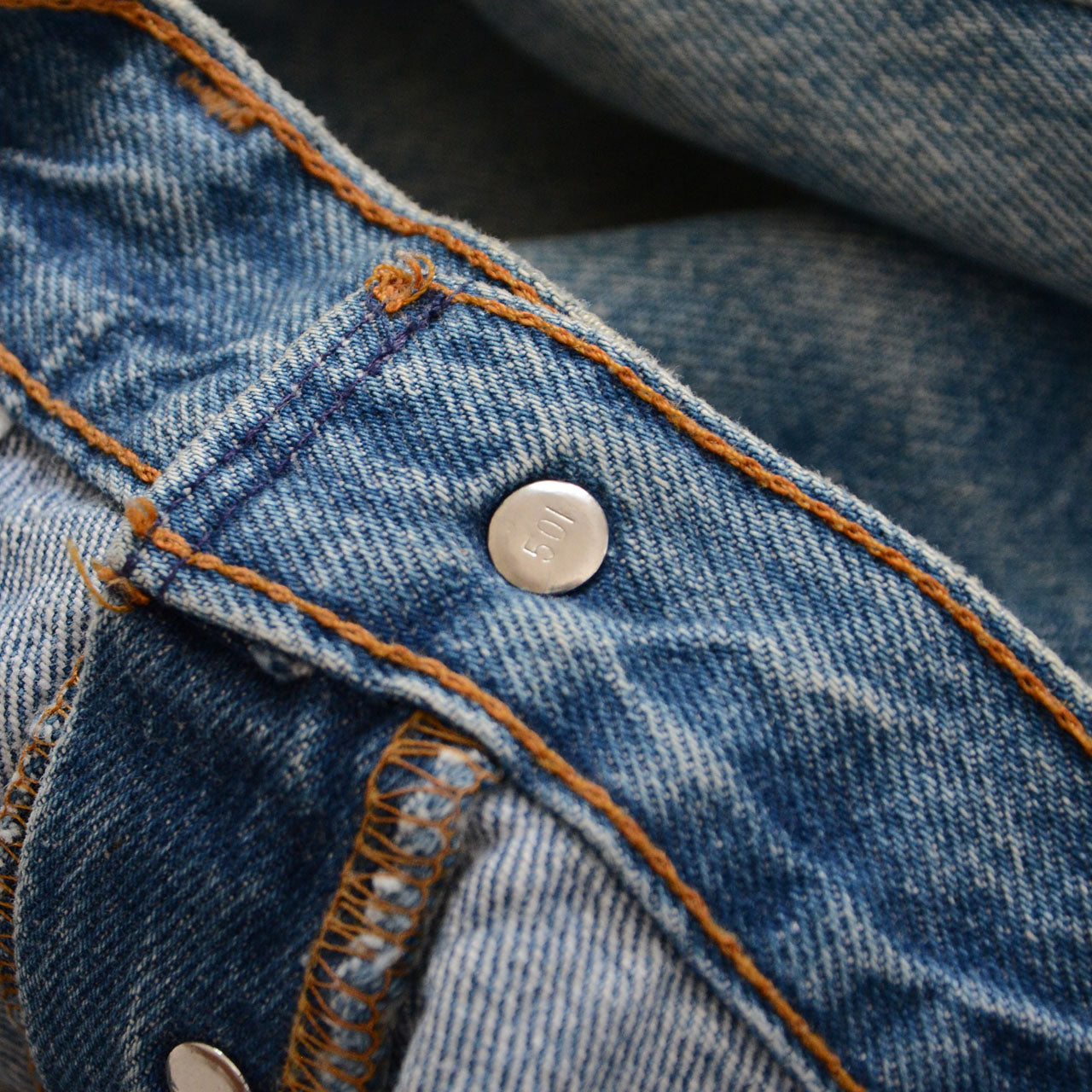 Levi's 501 vintage denim, worn indigo wash, raw hem detail