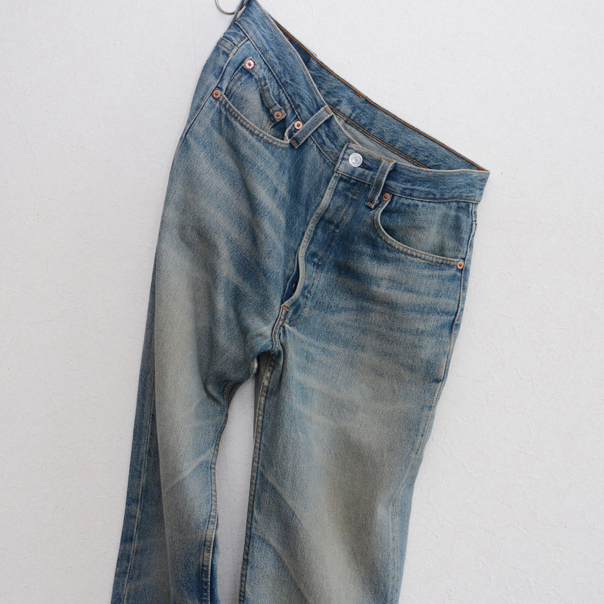 1993 Levi’s 501 jeans made in USA with faded blue denim and copper-tone rivets