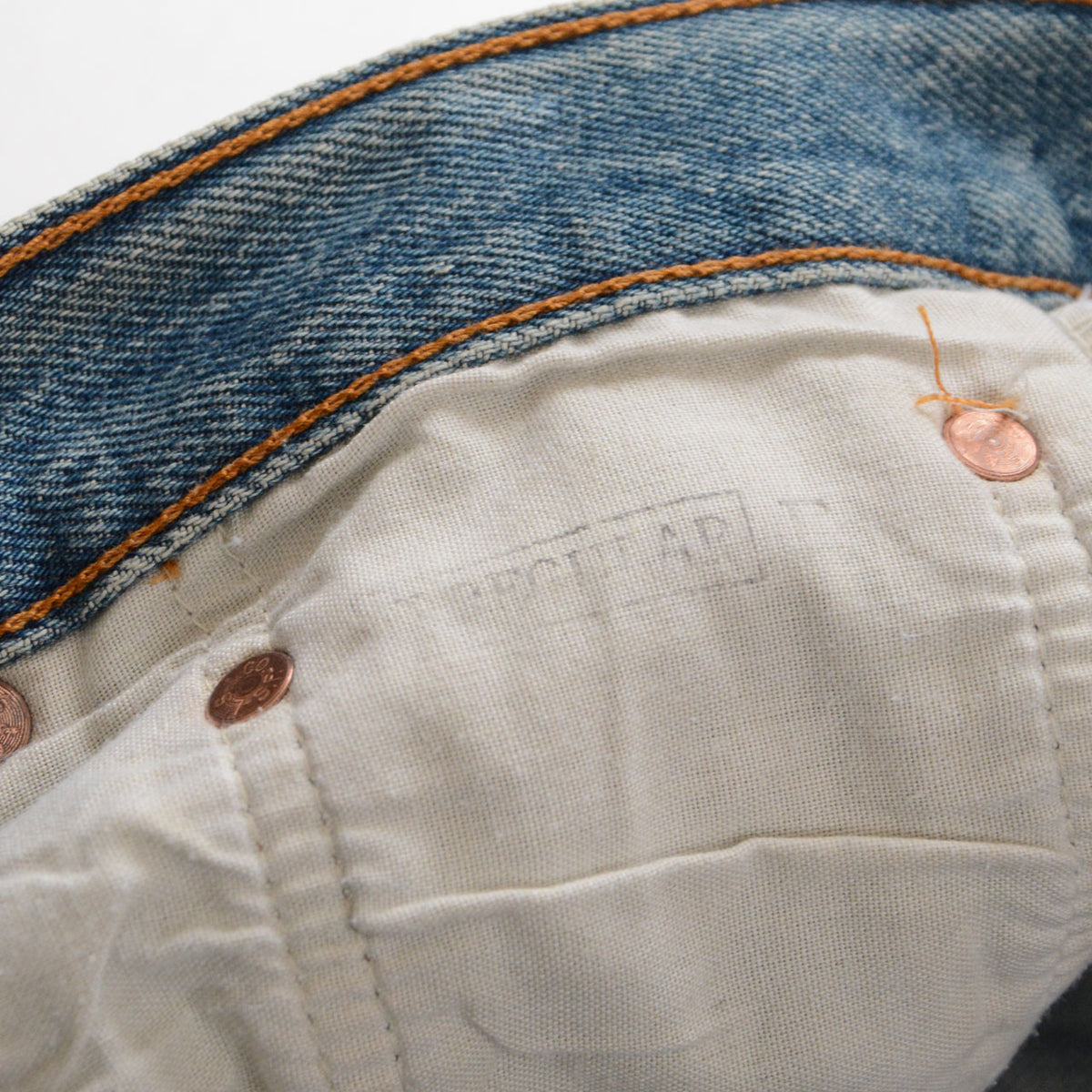 Levi’s 501 pocket lining with a faint irregular stamp and copper-tone rivet backs