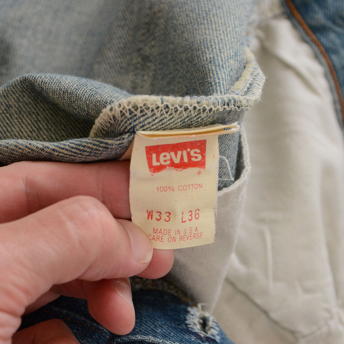 Levi’s label showing 100% cotton, size W33 L36 and Made in U.S.A.