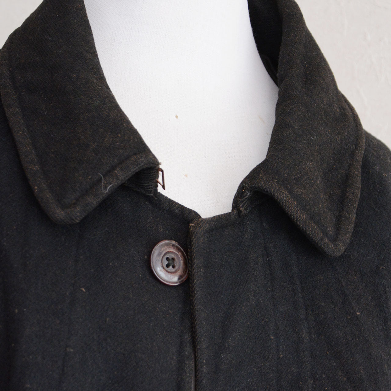 Japanese black wool mantle with neck strap and mismatched buttons