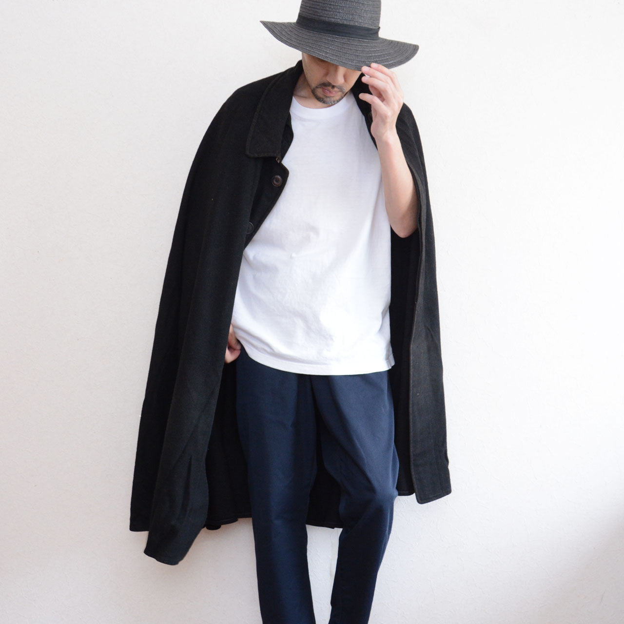 Antique Japanese bankara mantle worn over a white T-shirt and trousers