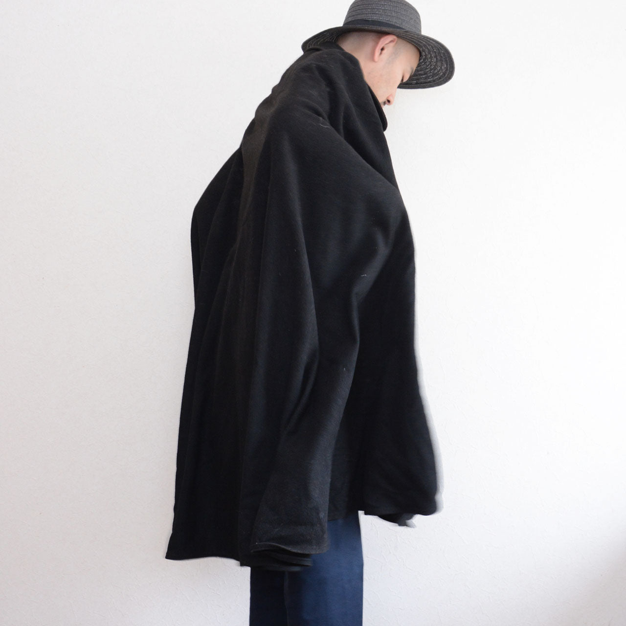 Japanese vintage black wool cape showing its side silhouette