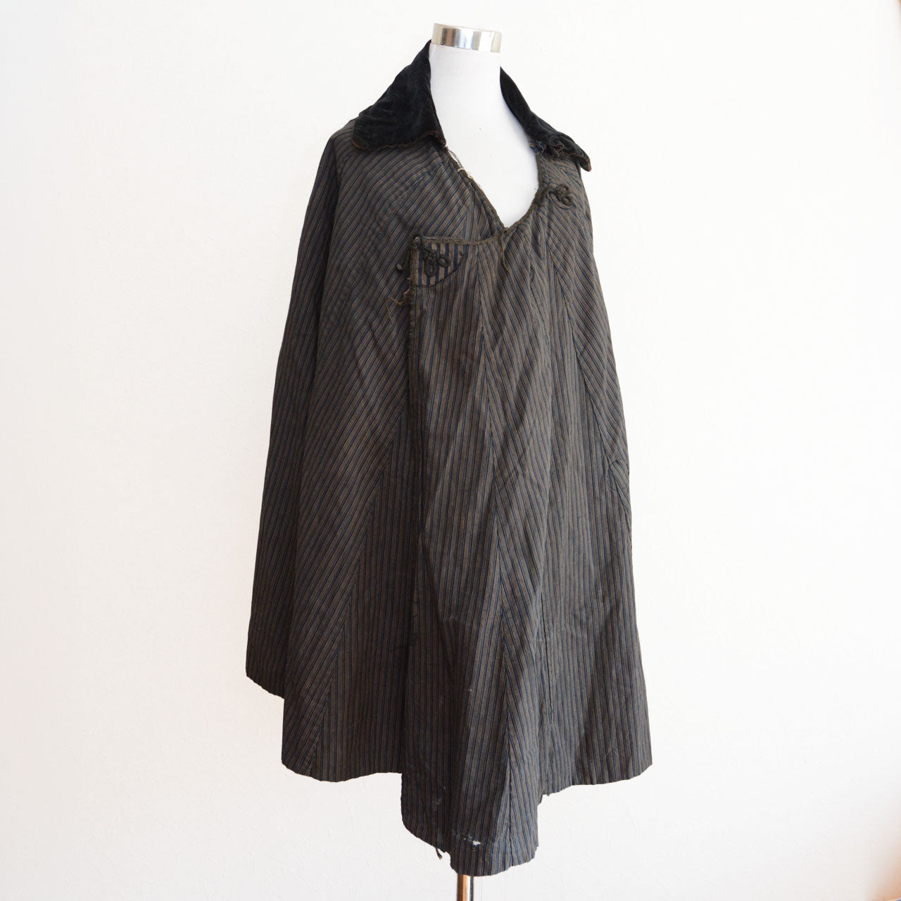 A Japanese vintage indigo-dyed cotton douchu kappa rain coat from the late Meiji to early Showa period.
