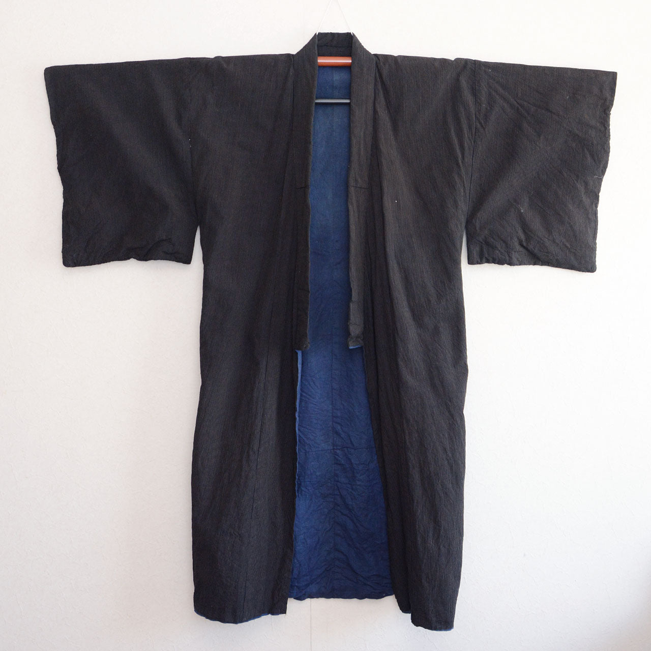 Outer fabric full view, front — dark cotton stripe pattern on kimono hanger, early Showa era Japan vintage men's kimono