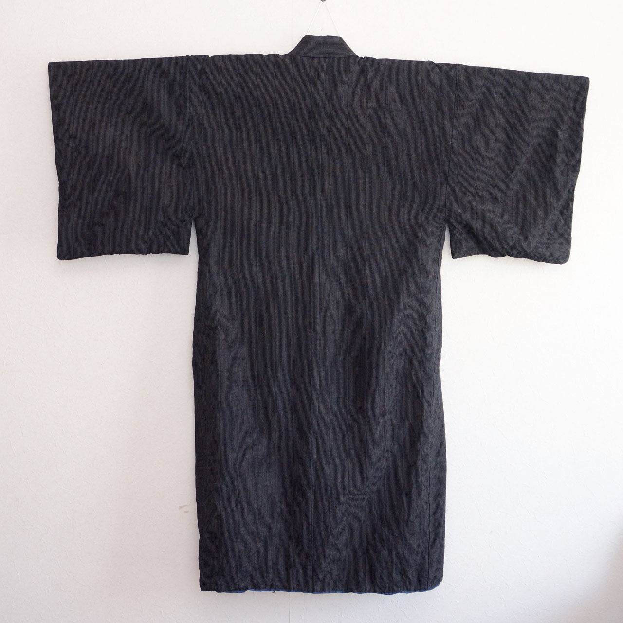 Outer fabric full view, back — dark cotton stripe pattern on kimono hanger, early Showa era Japan vintage men's kimono