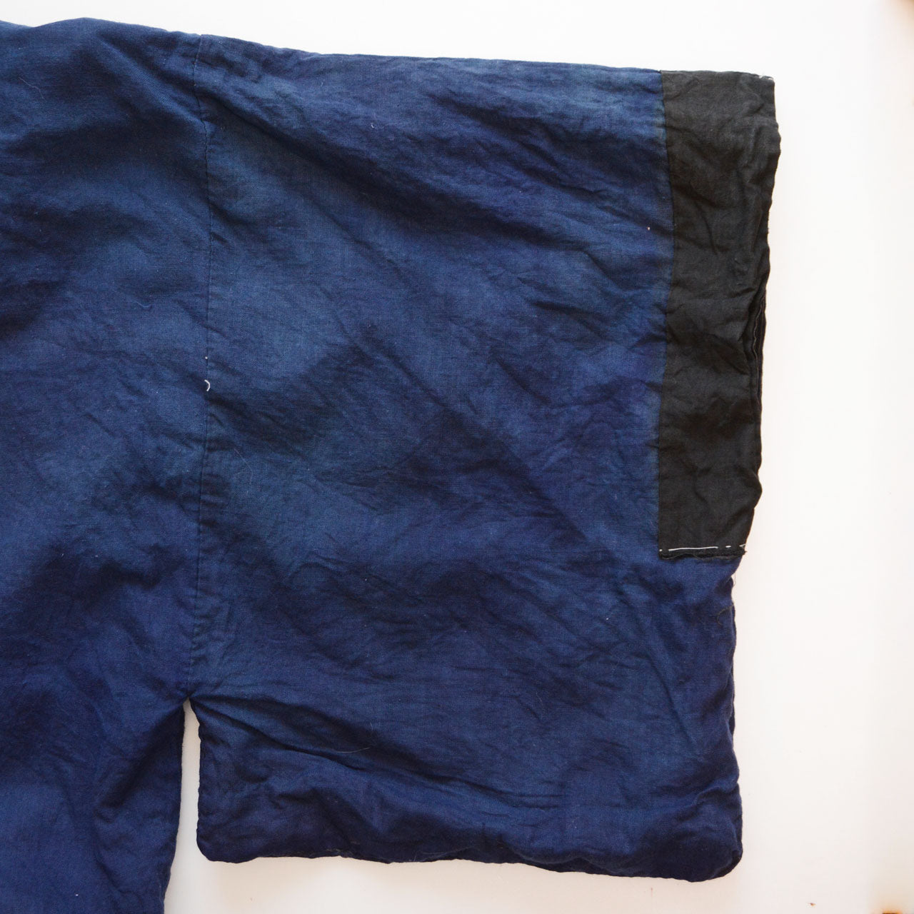 Full sleeve view — deep blue solid cotton with black contrast cuff, early Showa era Japan vintage men's kimono