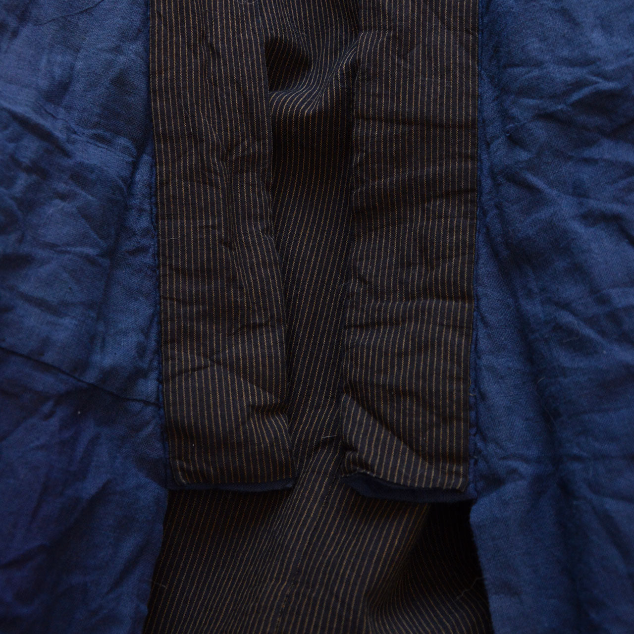 Collar base detail — black collar contrast against deep blue cotton lining, early Showa era Japan vintage men's kimono
