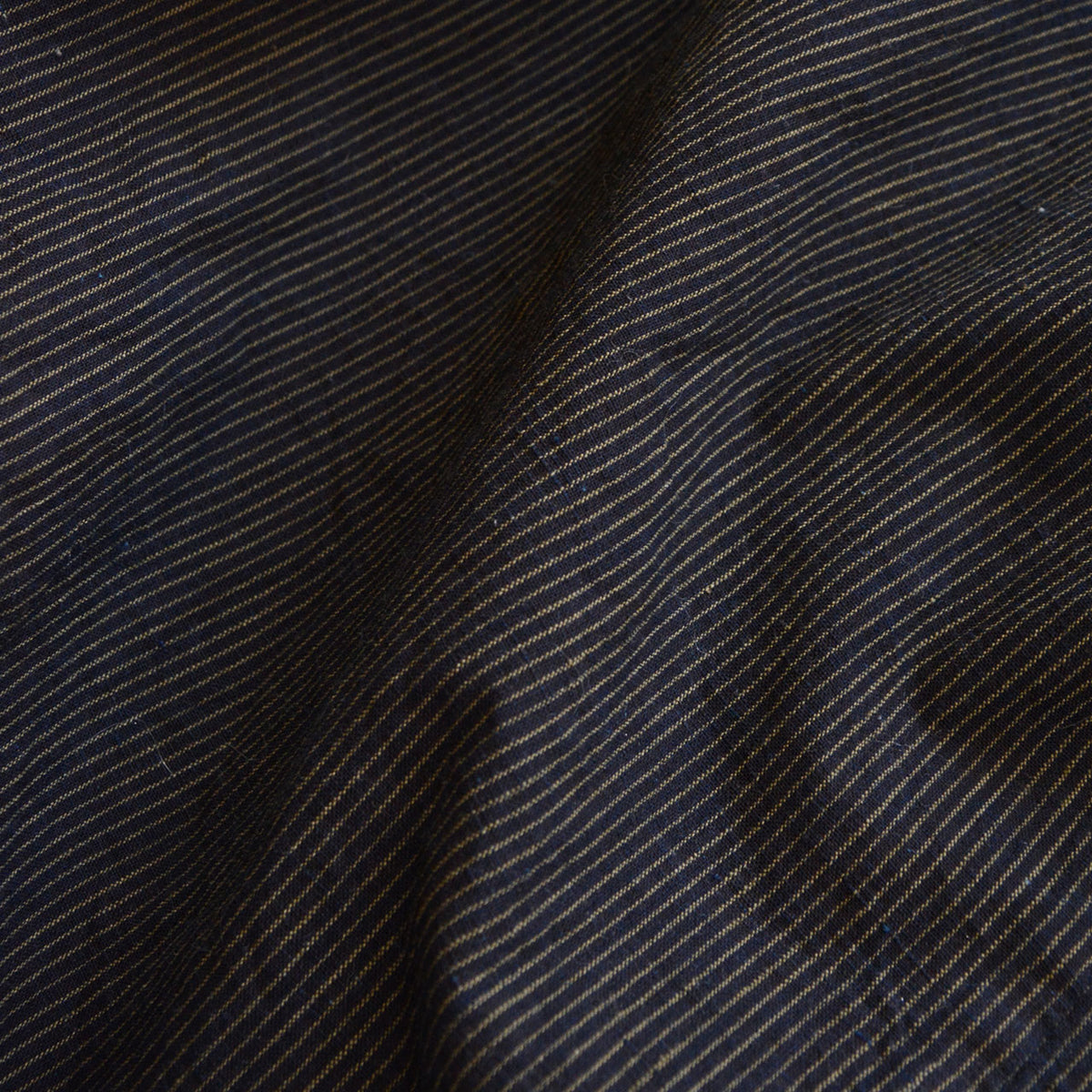 Fine indigo stripes and cotton weave of a vintage men's kimono