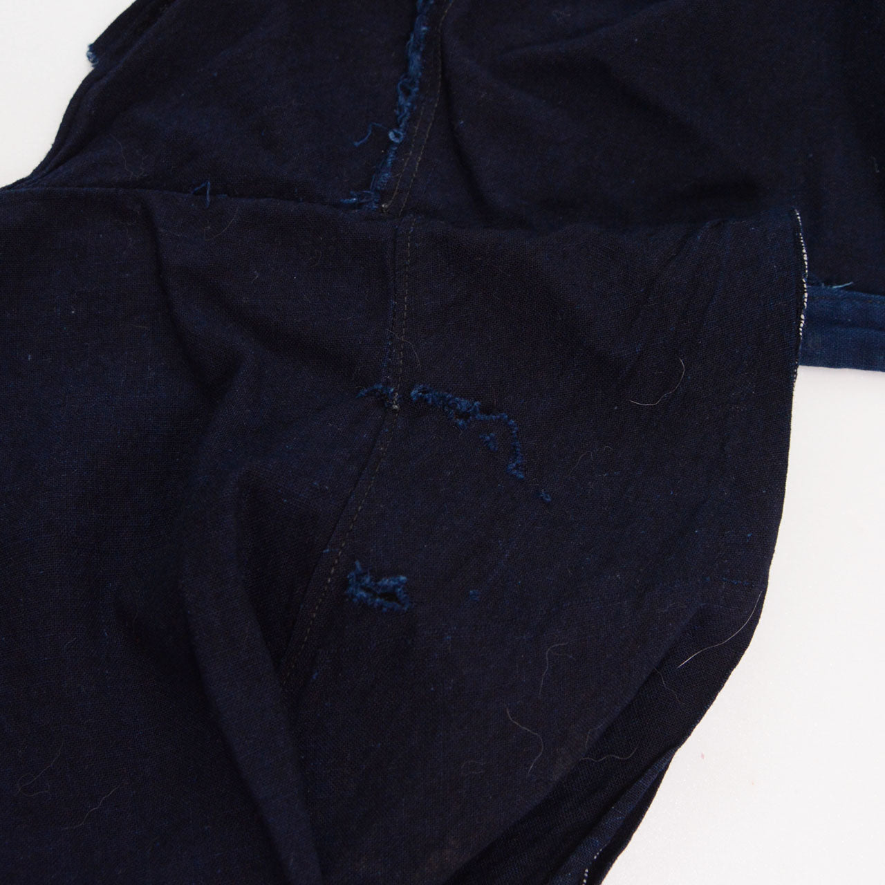 Damage detail on indigo cotton fabric of the momohiki