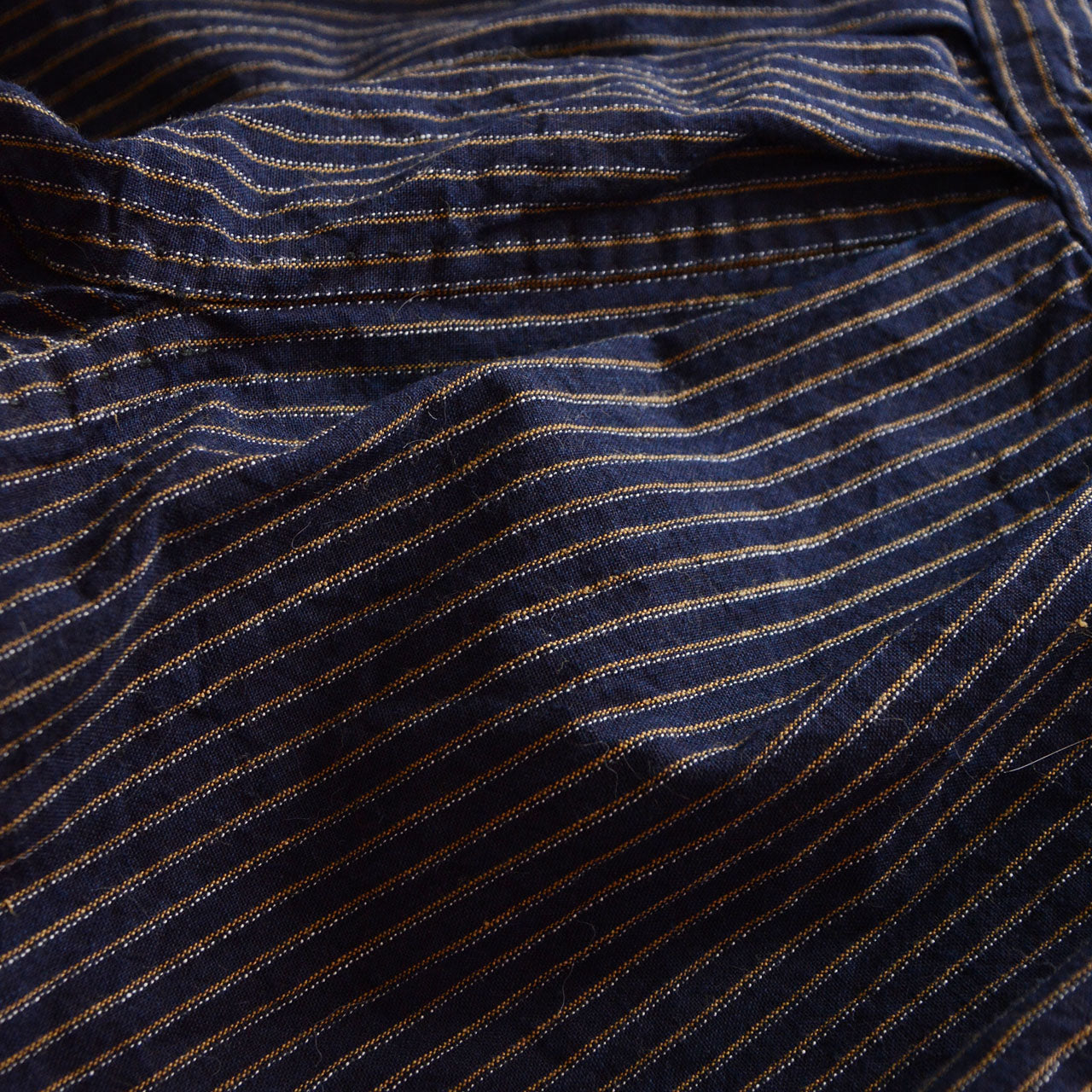 Front view of Showa era mompe pants, navy stripe cotton with gathered waist and tie strings, Japanese vintage