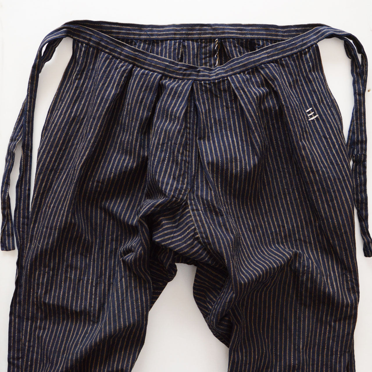 Gathered front waist detail of vintage Japanese mompe pants, navy stripe cotton, hand-sewn, Showa era Tohoku