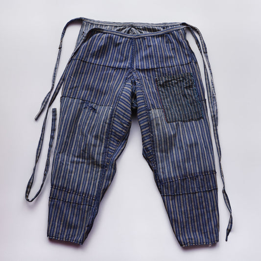 Reverse side of stripe cotton monpe pants, full view, blue and white multi-stripe cotton, waist ties, Tohoku Japan vintage, early-to-mid Showa era