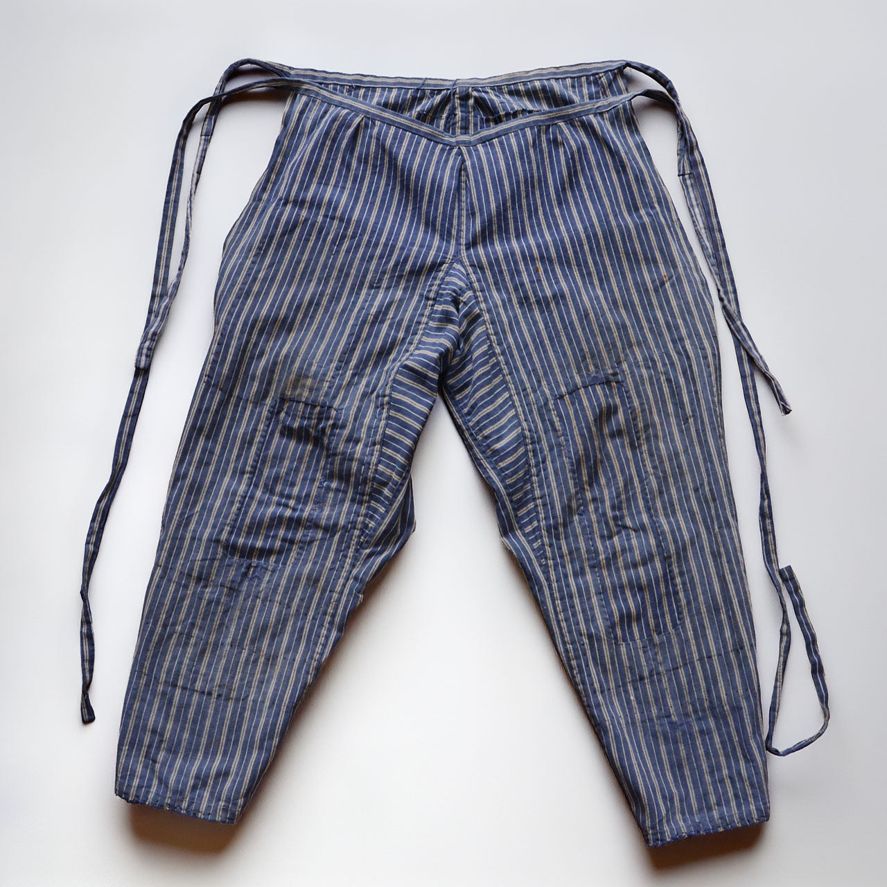 Front side of stripe cotton monpe pants, full view, blue and white multi-stripe cotton, waist ties, Tohoku Japan vintage, early-to-mid Showa era
