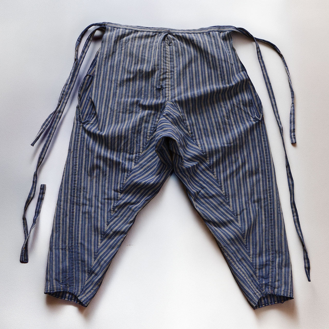 Back side of stripe cotton monpe pants, full view, blue and white multi-stripe cotton, Tohoku Japan vintage, early-to-mid Showa era