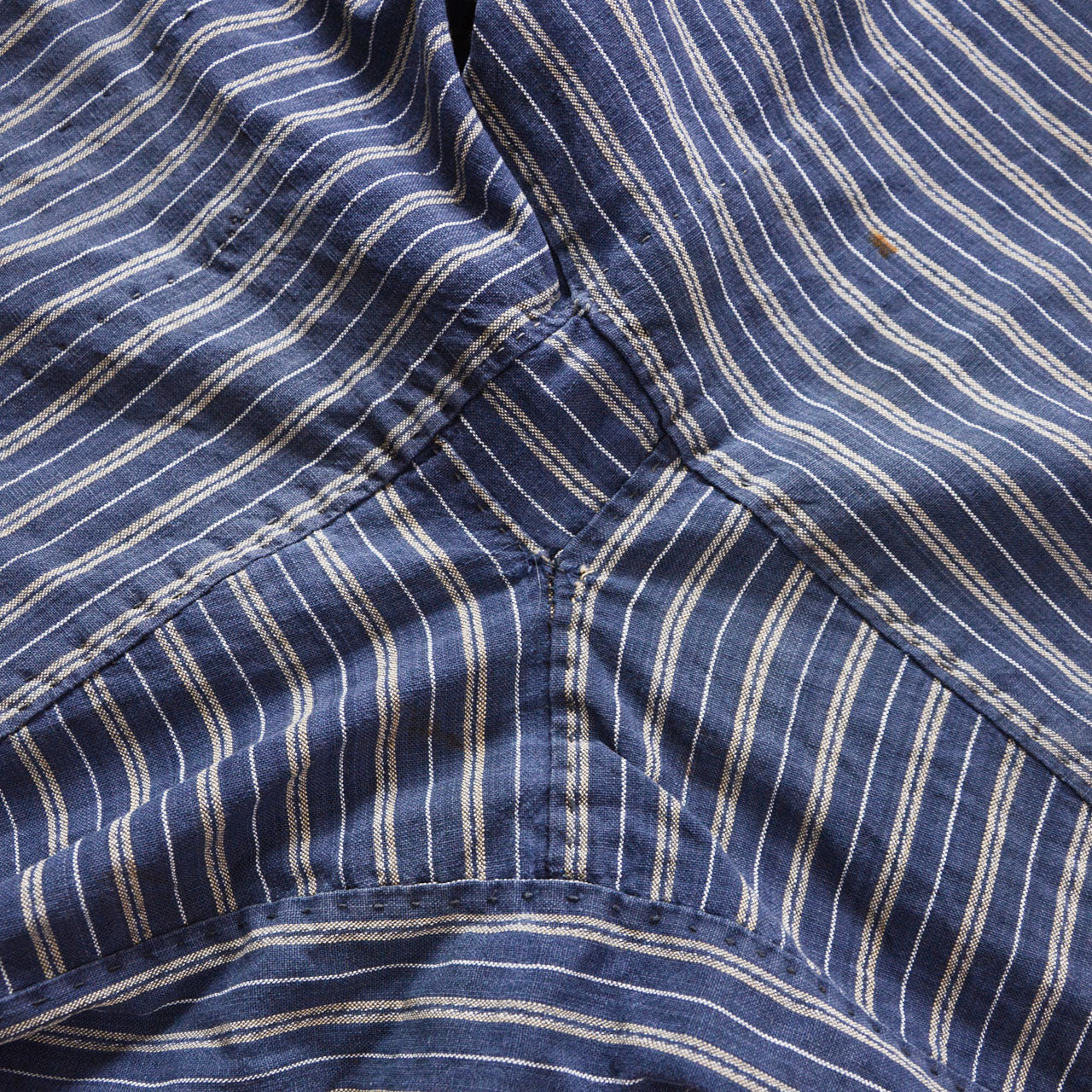 Crotch gusset detail of stripe cotton monpe pants, blue and white stripe cotton, hand-stitched construction, Tohoku Japan vintage