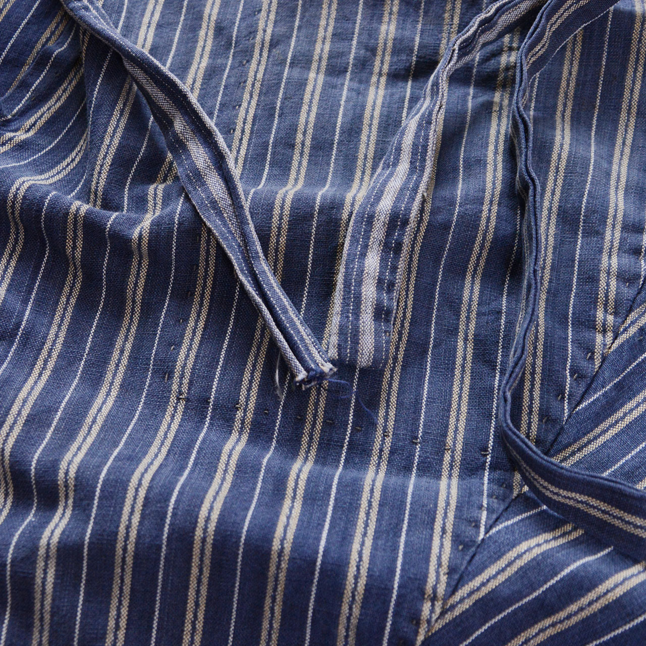 Waist tie end detail of stripe cotton monpe pants, frayed cotton cord tip, blue stripe cotton, Tohoku Japan vintage