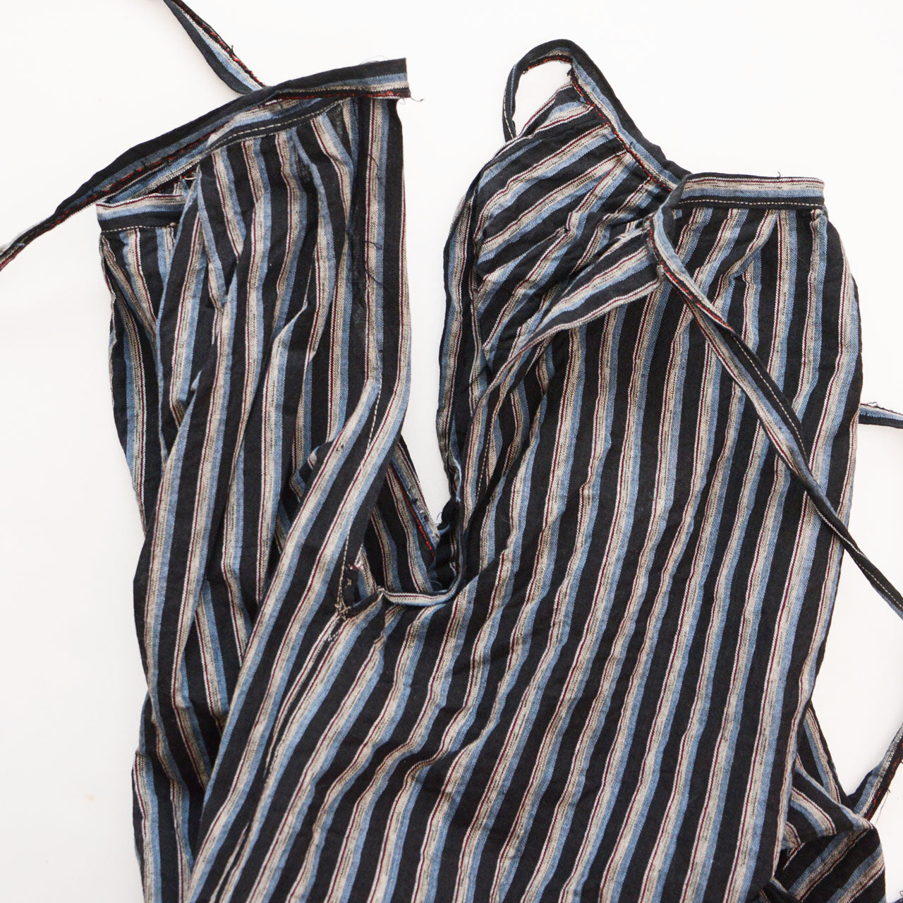 Side slit detail of vintage Japanese monpe pants in striped cotton