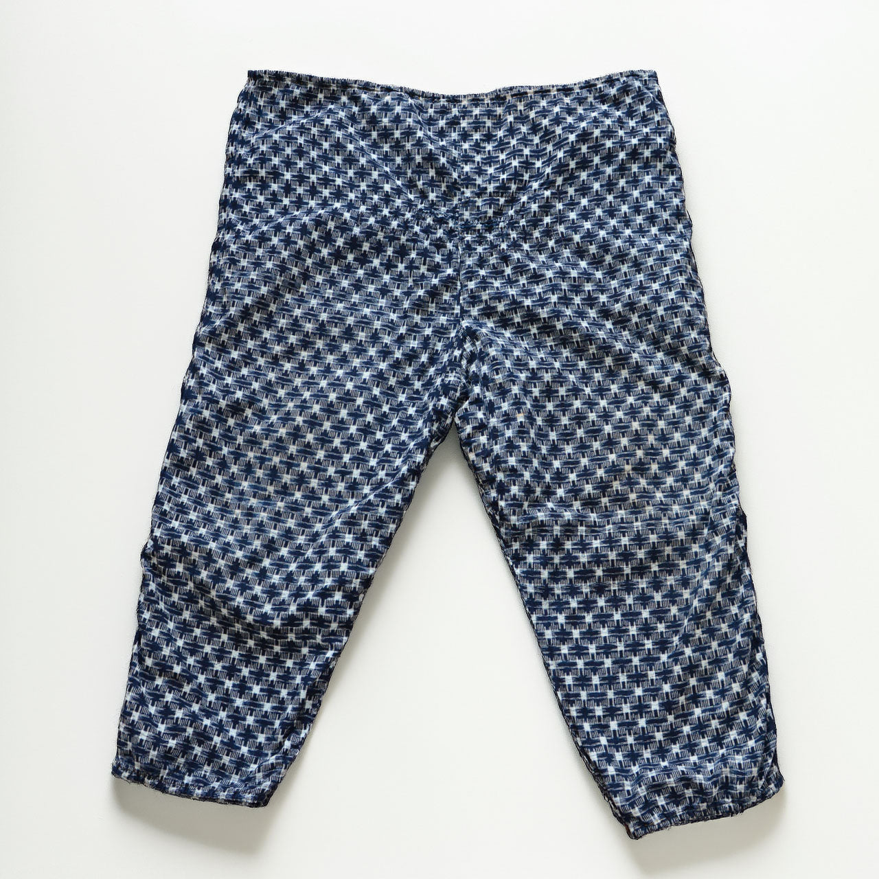 Indigo kasuri cotton monpe pants, back view, navy and white ikat check pattern, Showa era Japanese vintage workwear