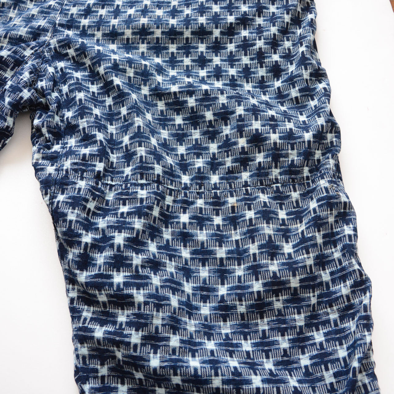 Patch repair detail on indigo kasuri cotton monpe pants, Showa era Japanese vintage workwear