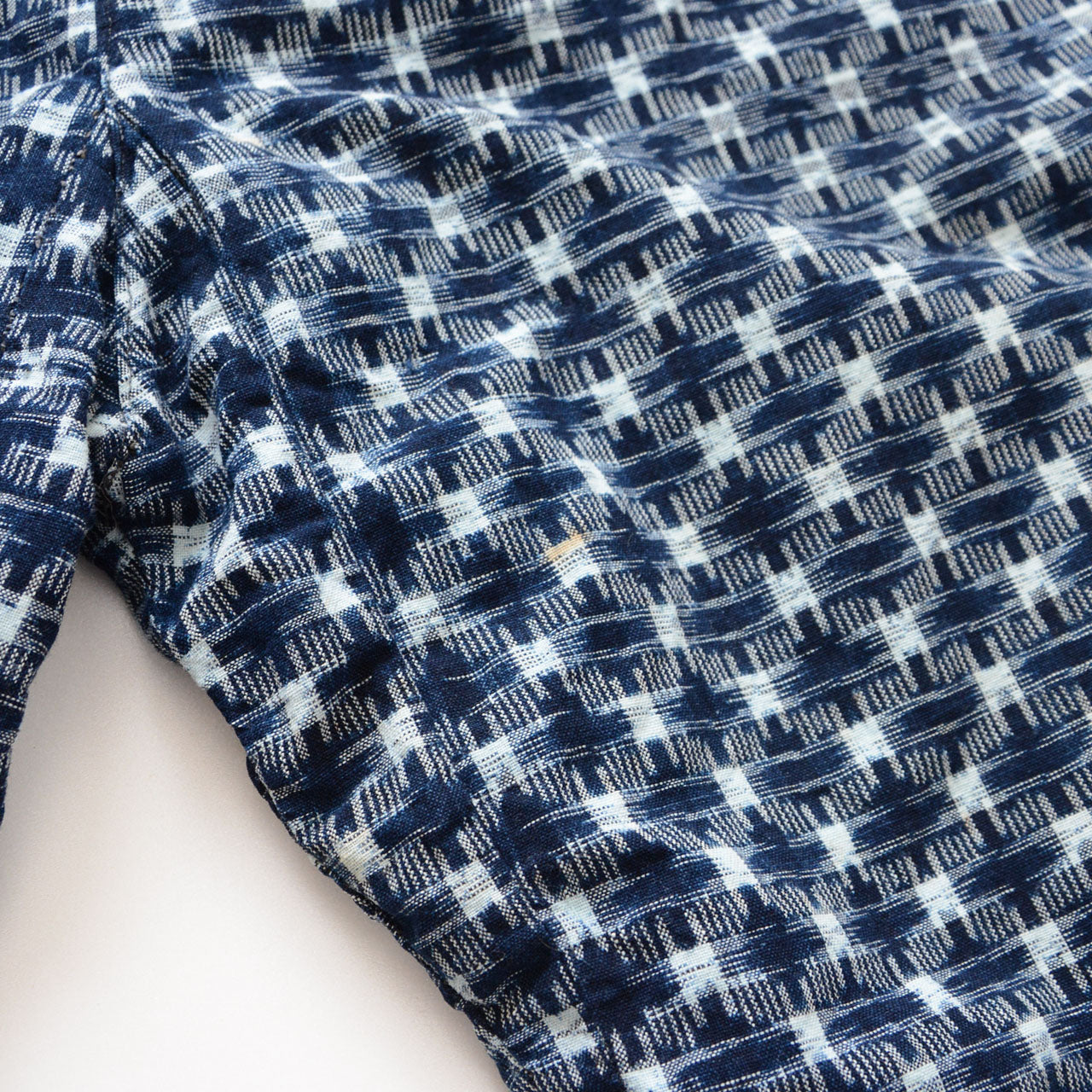 Soiling detail on indigo kasuri cotton monpe pants, age-related staining, Japan vintage