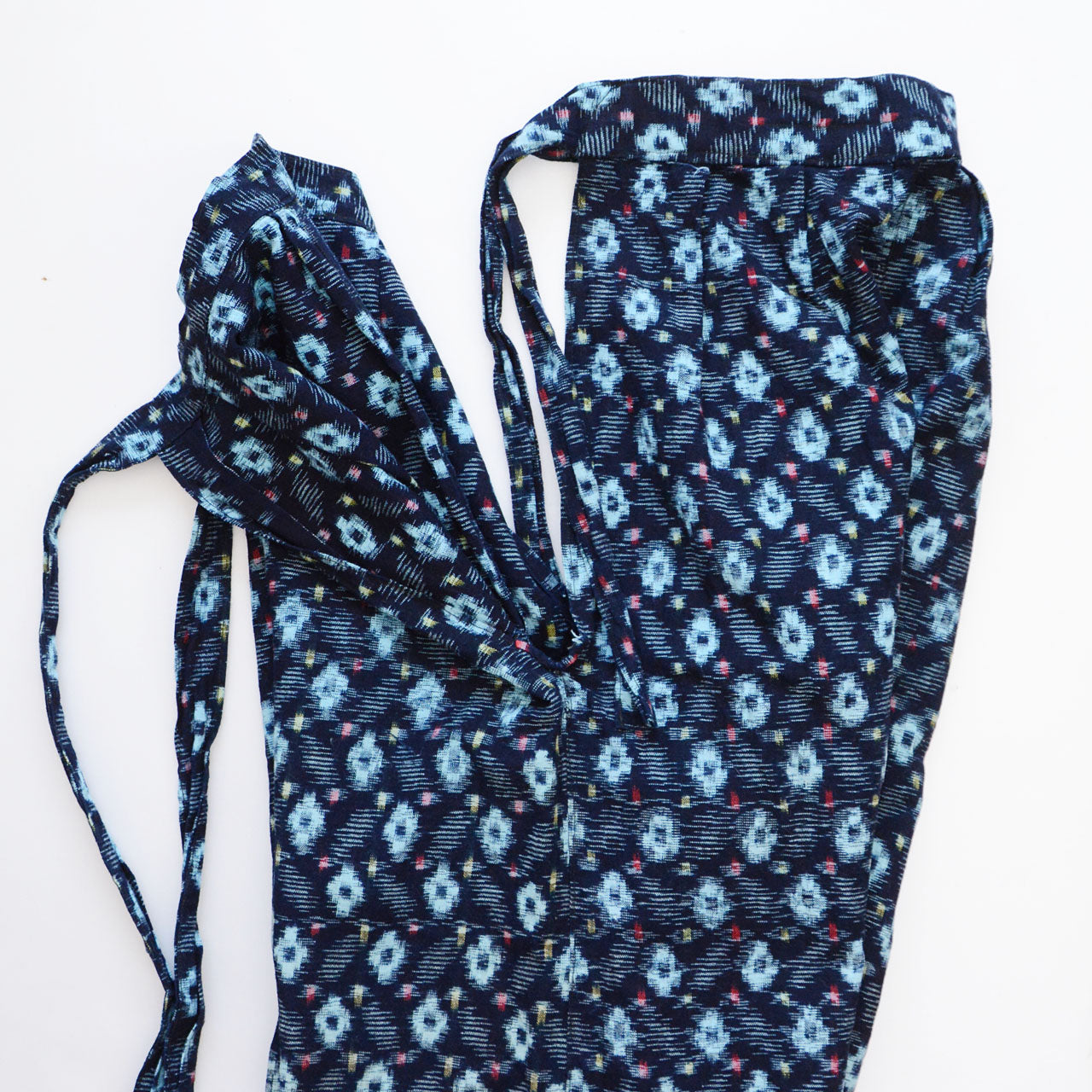 indigo kasuri cotton monpe — side slit detail separating front and back panels