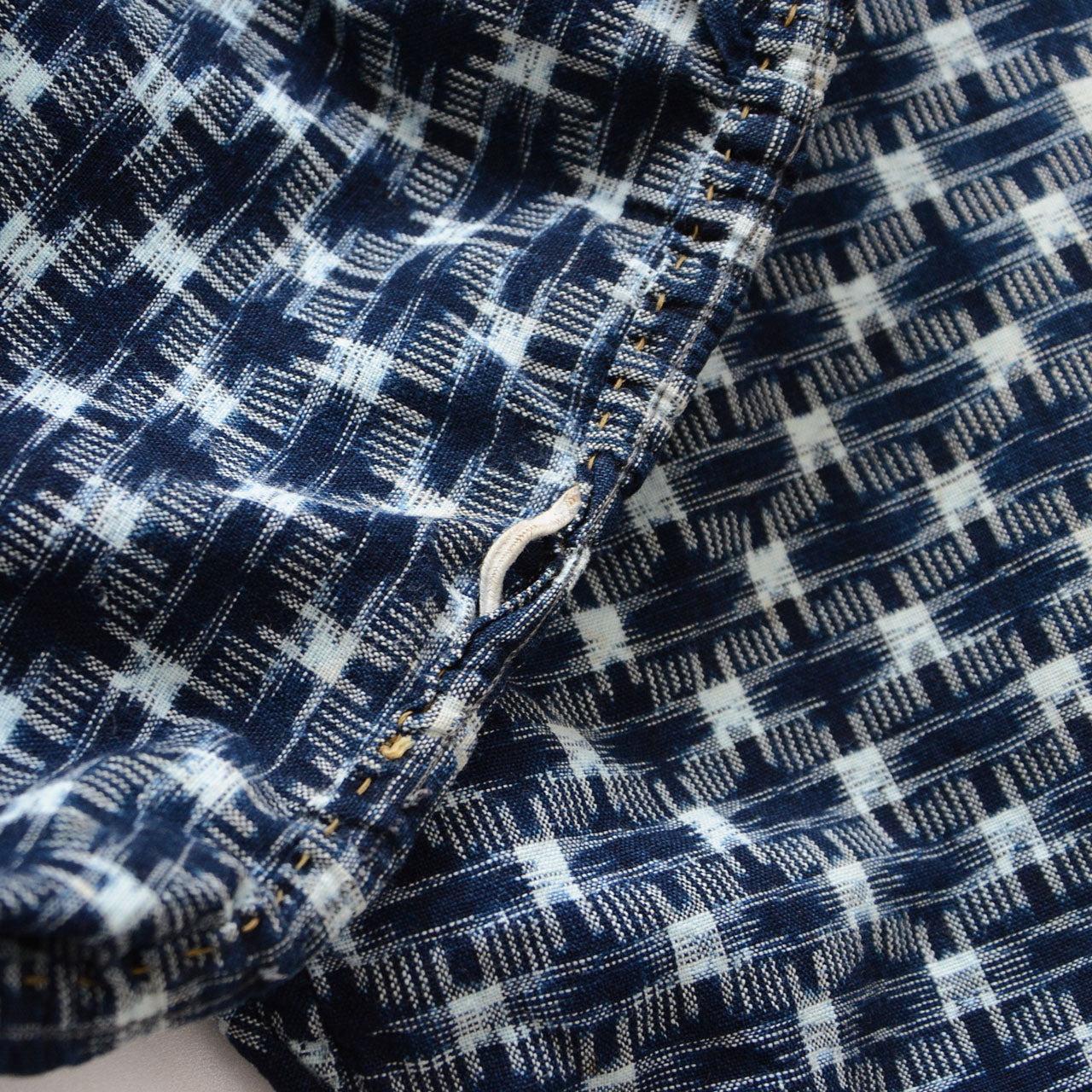 Waist elastic area of vintage Japanese monpe pants, stitch loss and deteriorated elastic, indigo kasuri cotton