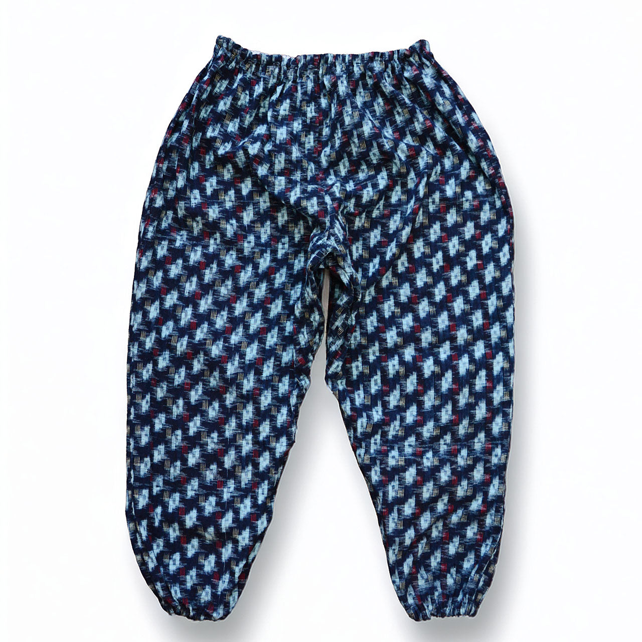 Indigo kasuri cotton monpe pants, back view, navy and white ikat pattern, elastic hem, Mid-Showa era Japanese vintage workwear