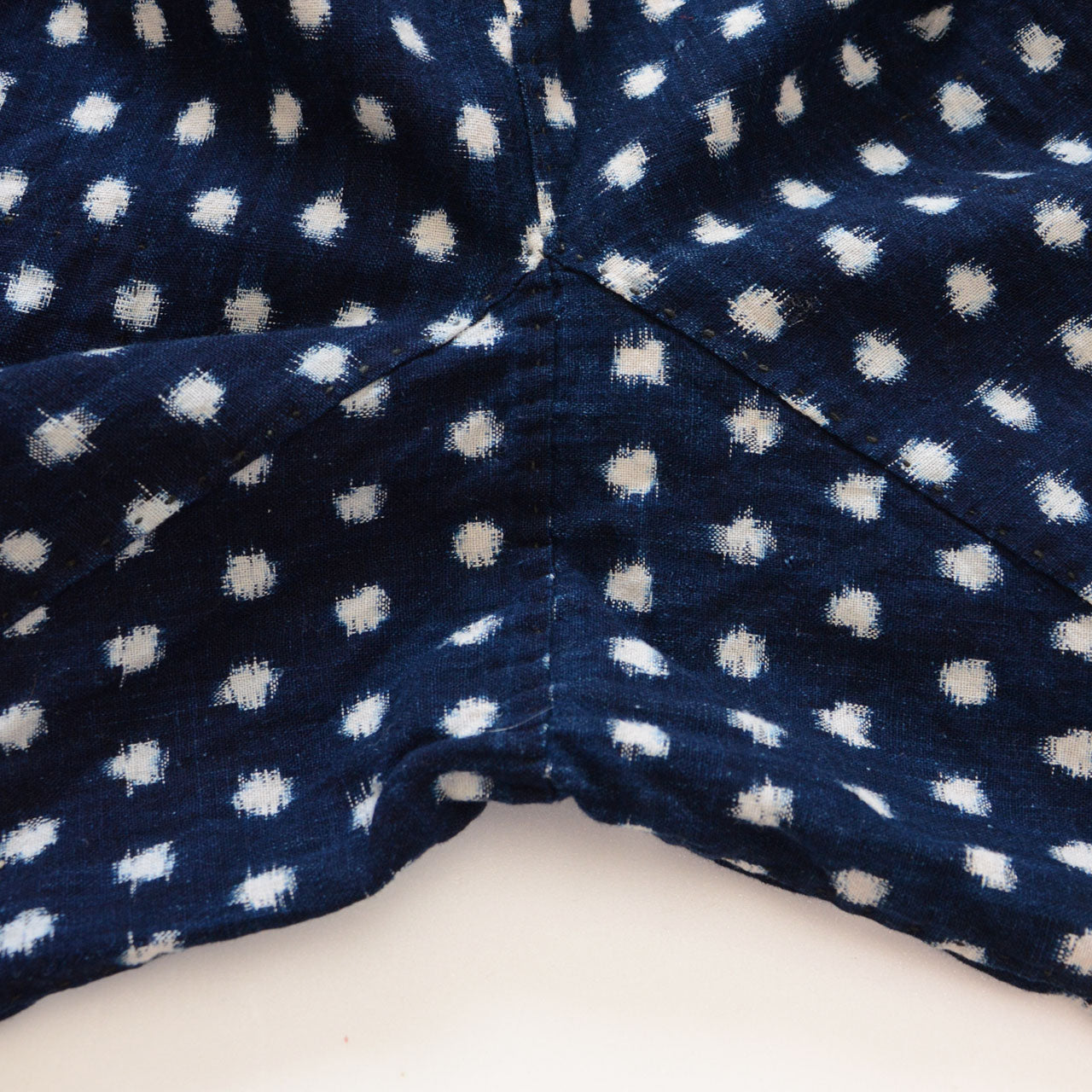 Crotch gusset construction detail, indigo snow pattern (Yukinko) kasuri cotton monpe, early Showa era Japan vintage