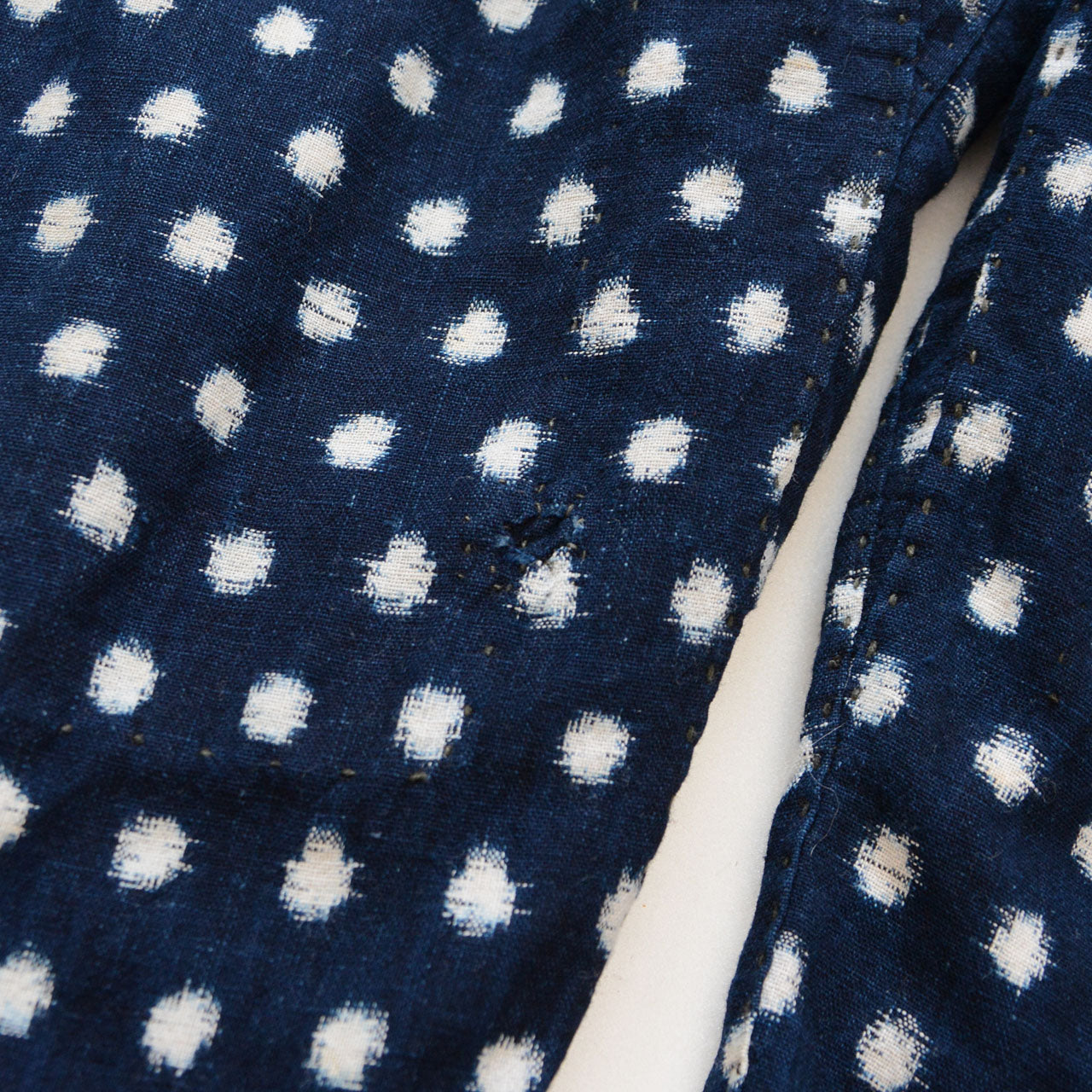 Previous repair on indigo snow pattern (Yukinko) kasuri cotton monpe, early Showa era Japan vintage