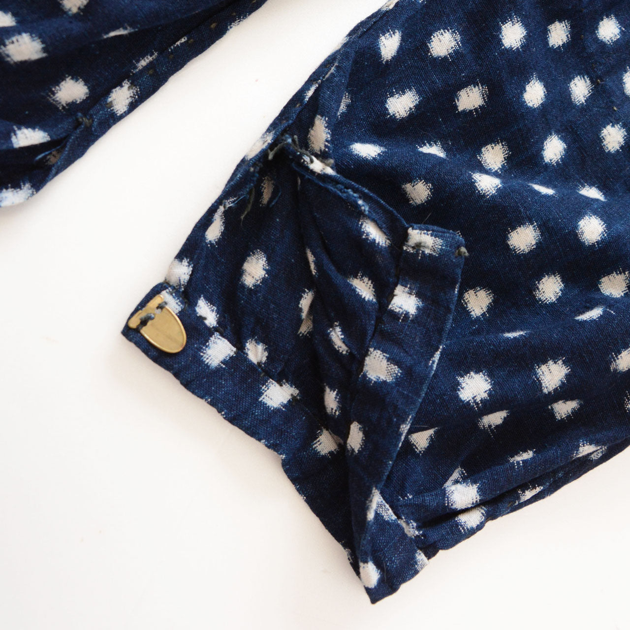 Kohaze metal fasteners at hem, indigo snow pattern (Yukinko) kasuri cotton monpe, early Showa era Japan vintage
